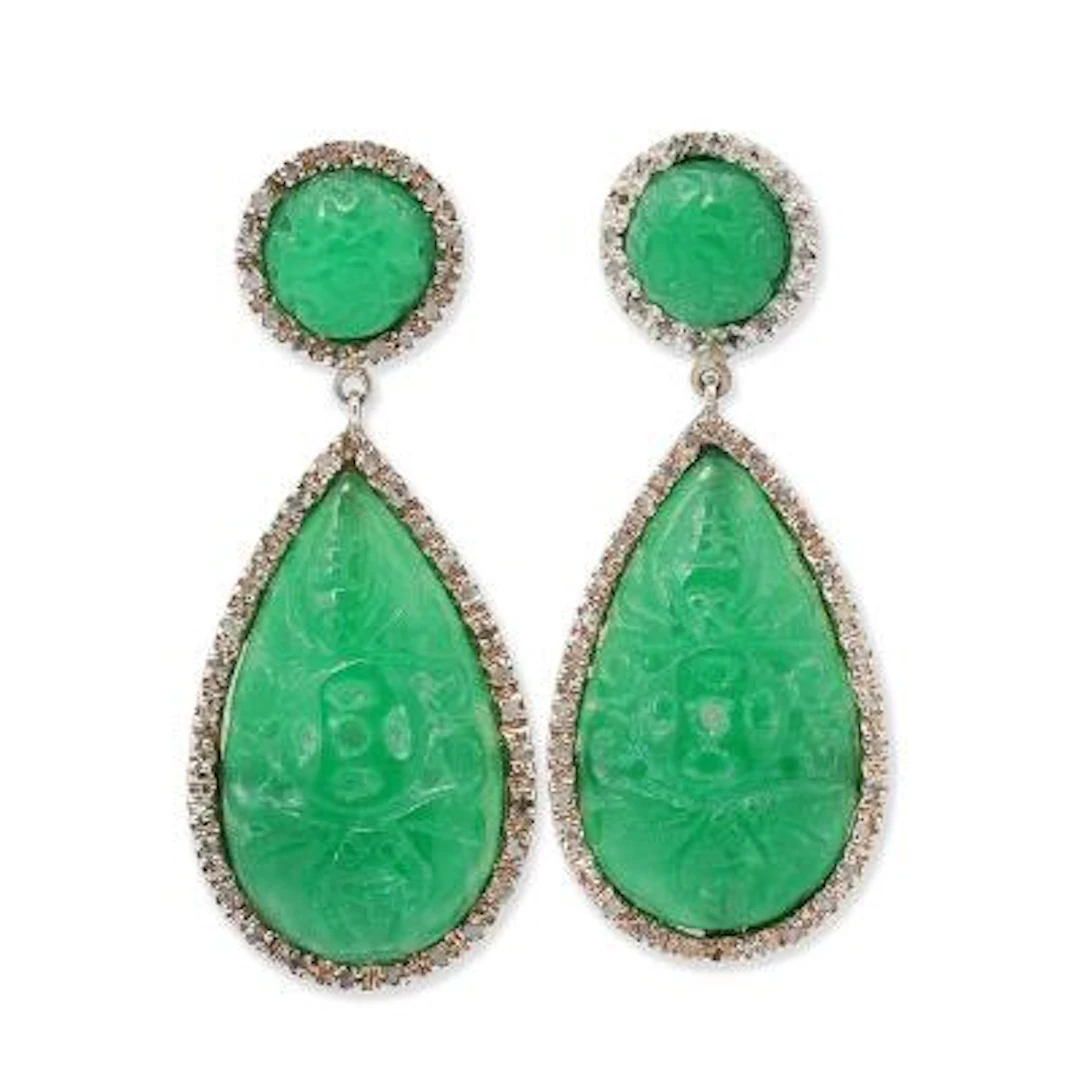 A pair of jade ear pendants set with jade encircled by diamonds mounted
