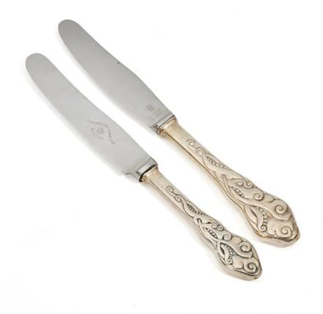 'Tang' 12 lunch knives and 12 dinner knives with silver handles. Copenhagen