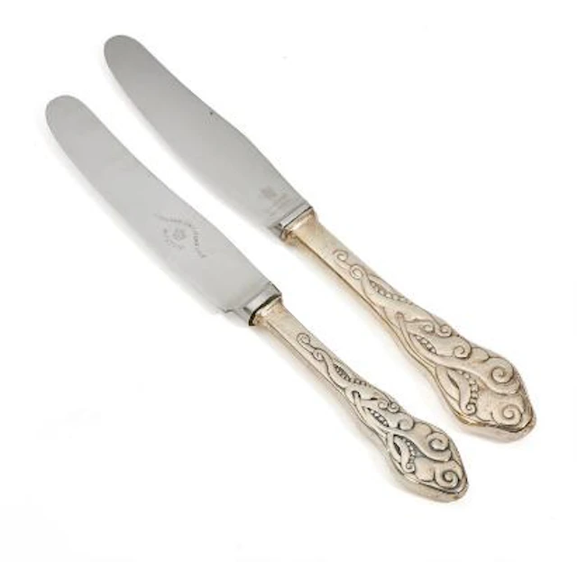 'Tang' 12 lunch knives and 12 dinner knives with silver handles. Copenhagen