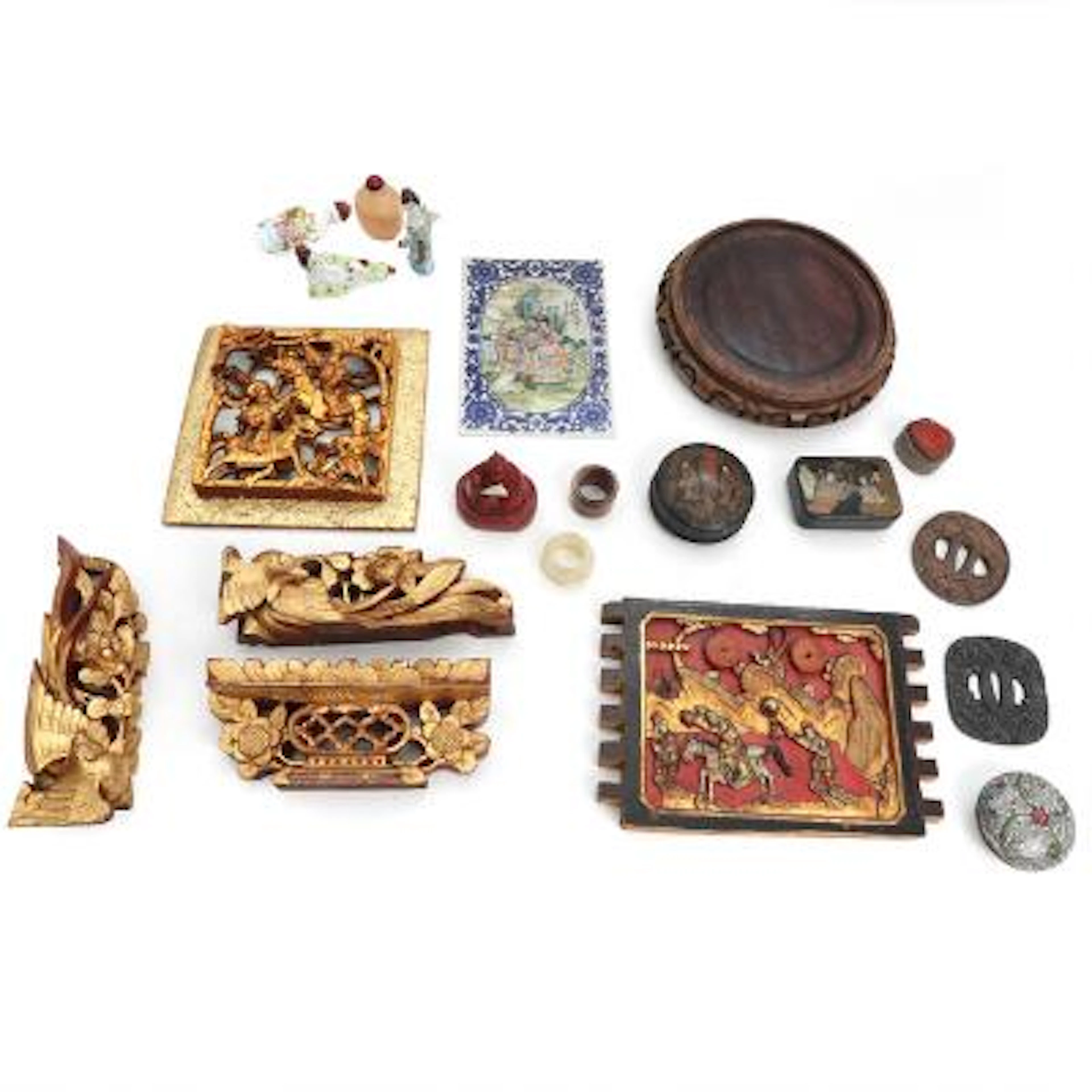 A collection of Asian artifacts of jade, iron, porcelain a.o. 19th–20th