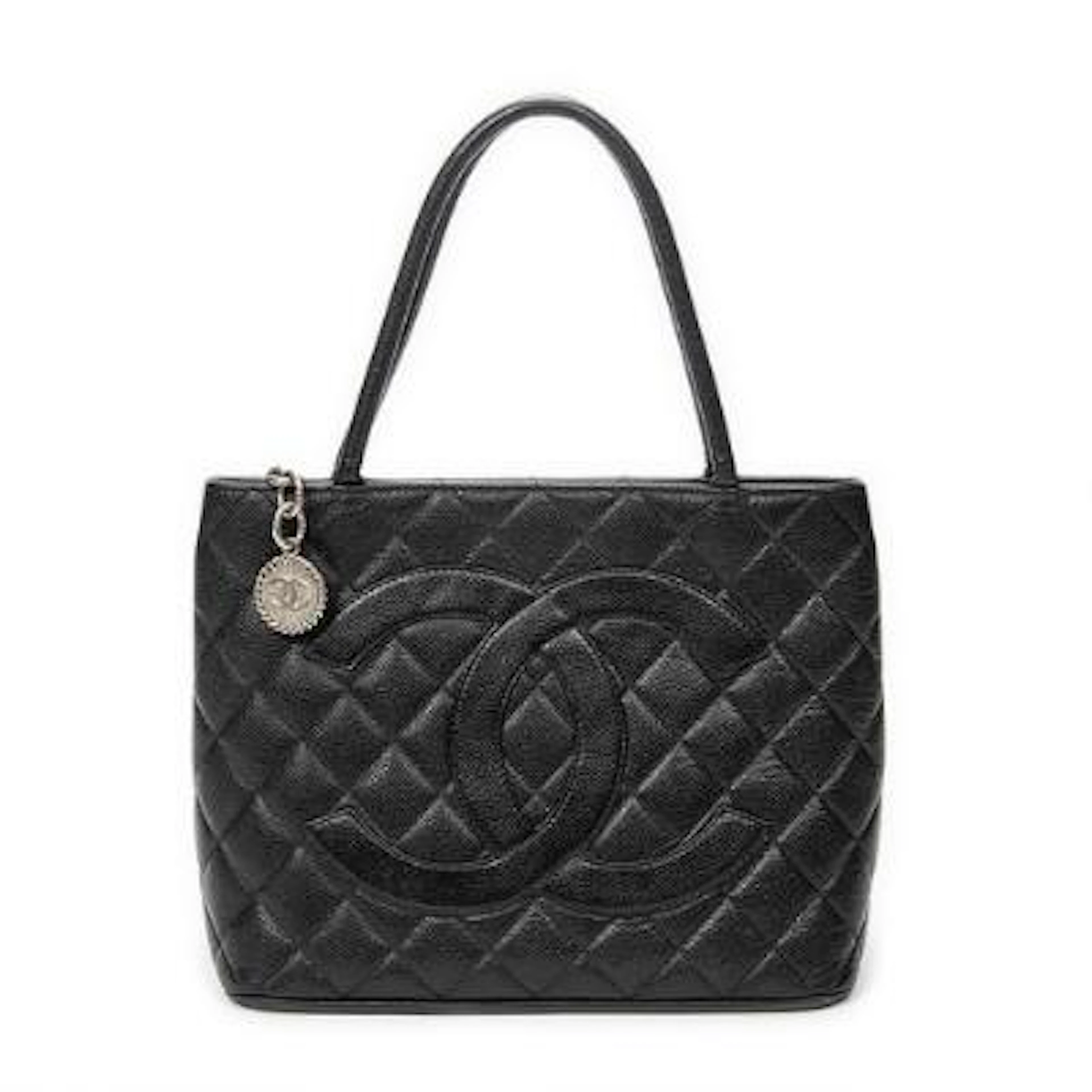 Chanel: A "Medallion" bag of black quilted Caviar leather with silver-toned