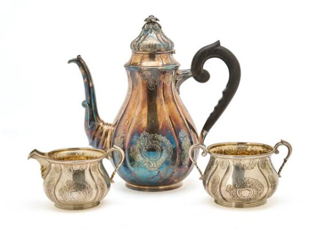 Silver coffee service comprising coffee pot, sugar bowl and cream