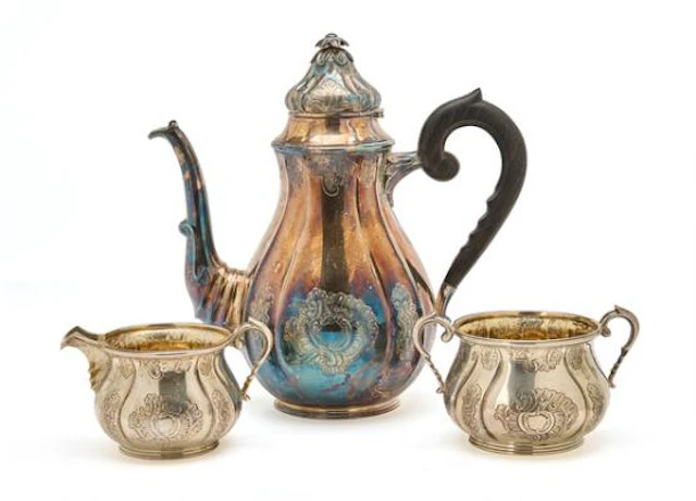 Silver coffee service comprising coffee pot, sugar bowl and cream