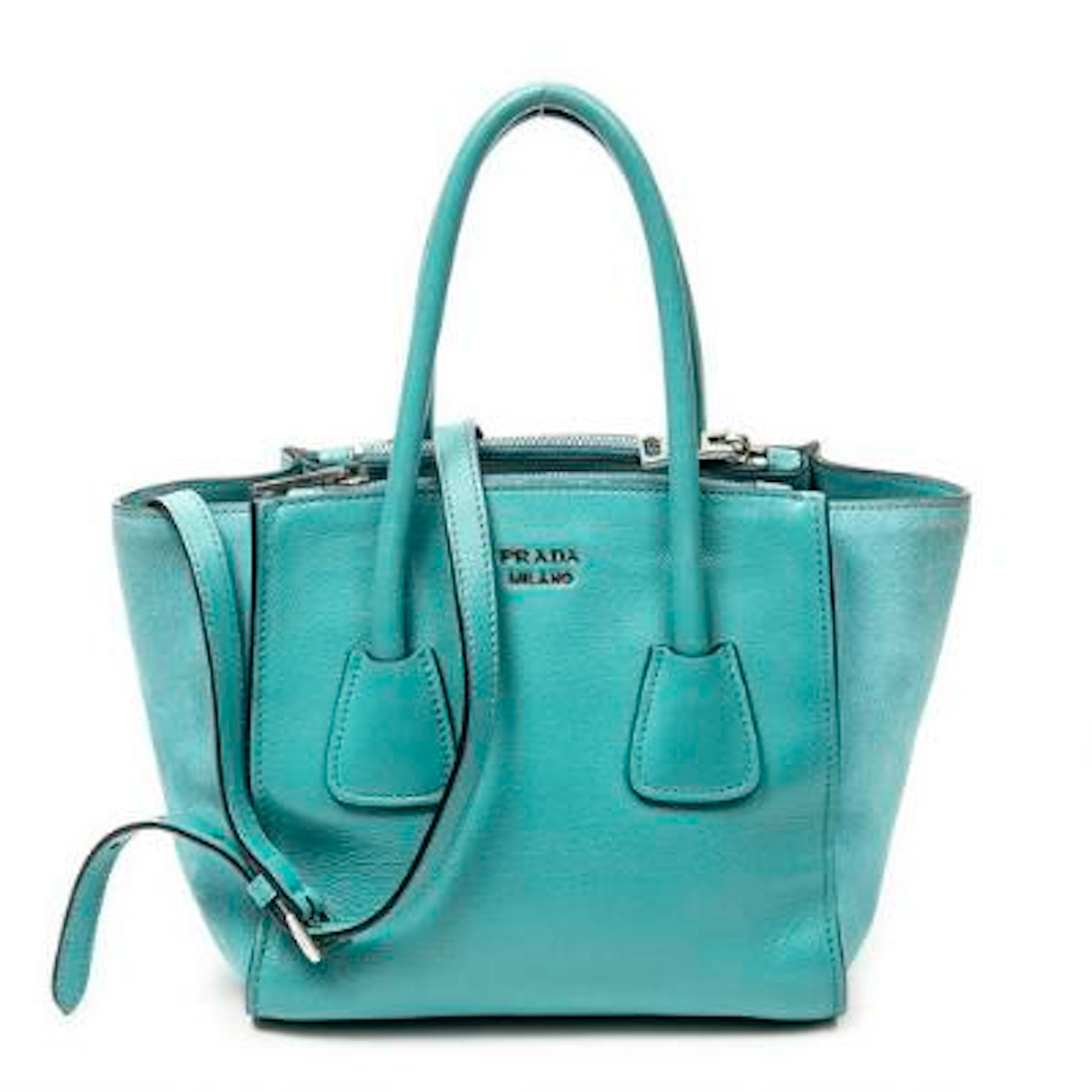 Prada: A "Small Twin Pocket" bag in turquoise leather and suede with