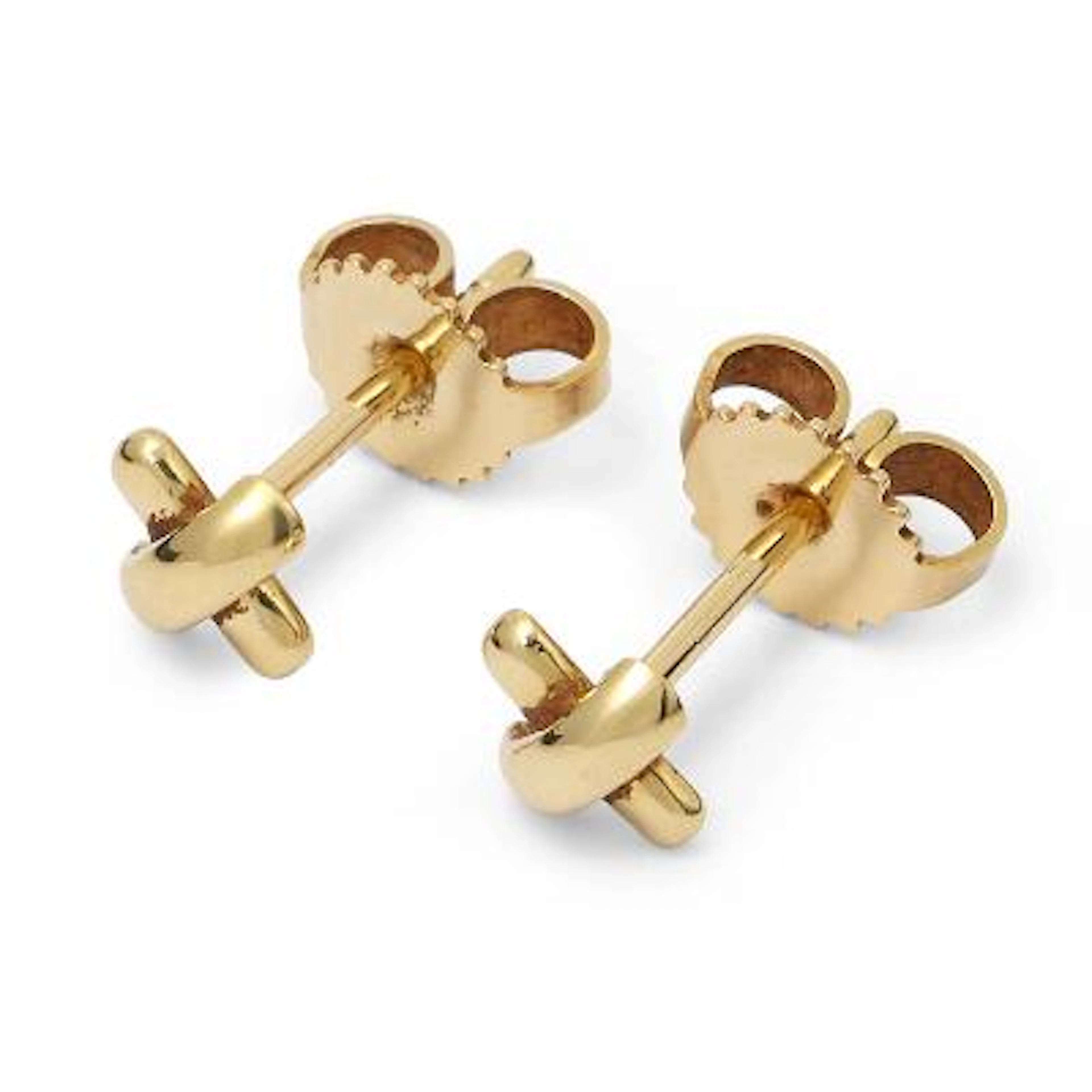 Tiffany & Co.: A pair of "Cross Stich" ear studs of 18k gold. Weight