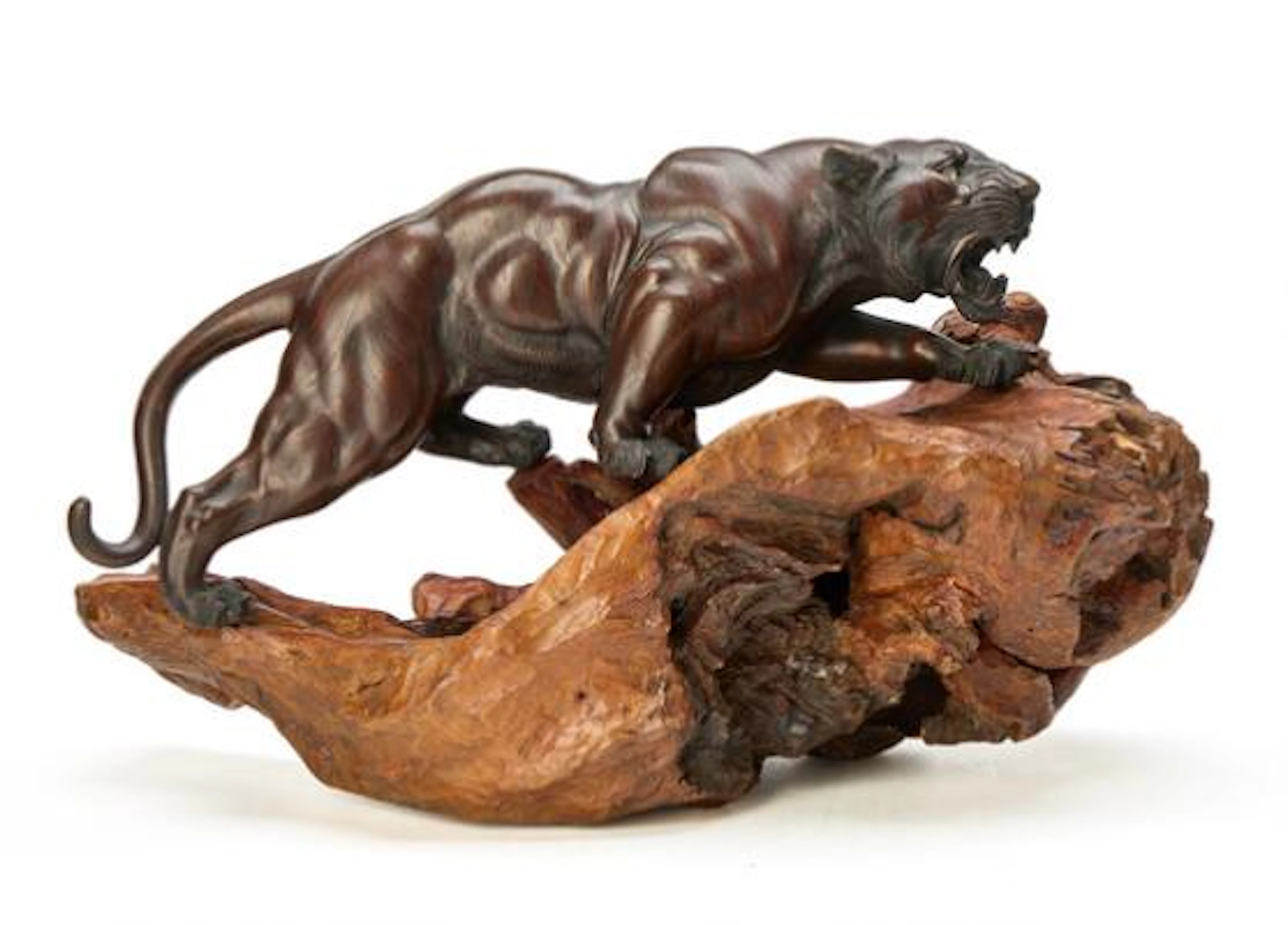 A Japanese bronze figure in the form of a tiger. Signed. Meiji 1862–1912.