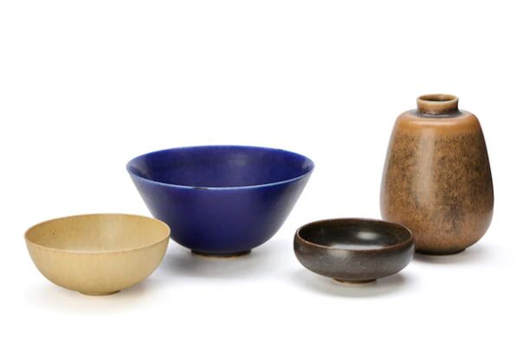 Saxbo: A collection of stoneware comprising three bowls and a vase.