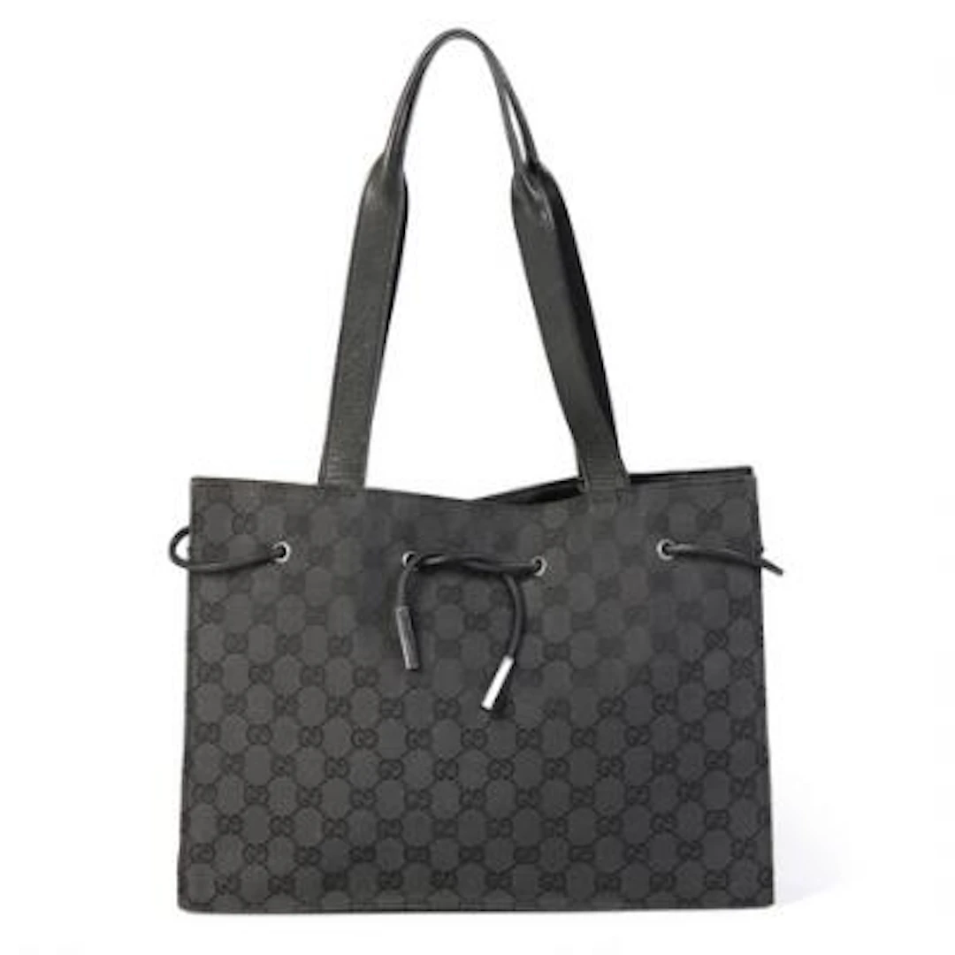 Gucci: A bag of black monogram canvas with black leather trimmings