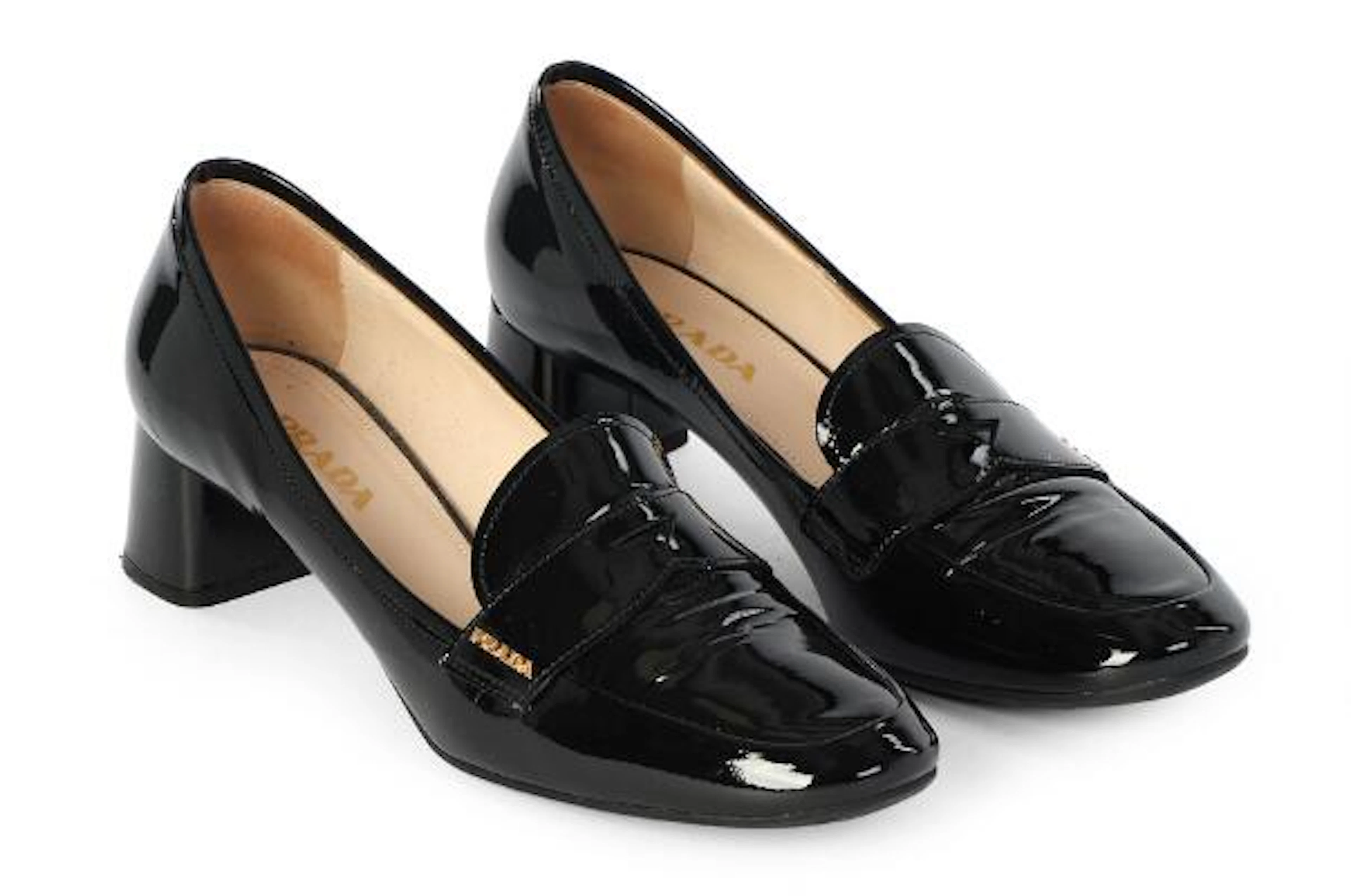 Prada: A pair of black patent leather loafers with a golden detail.