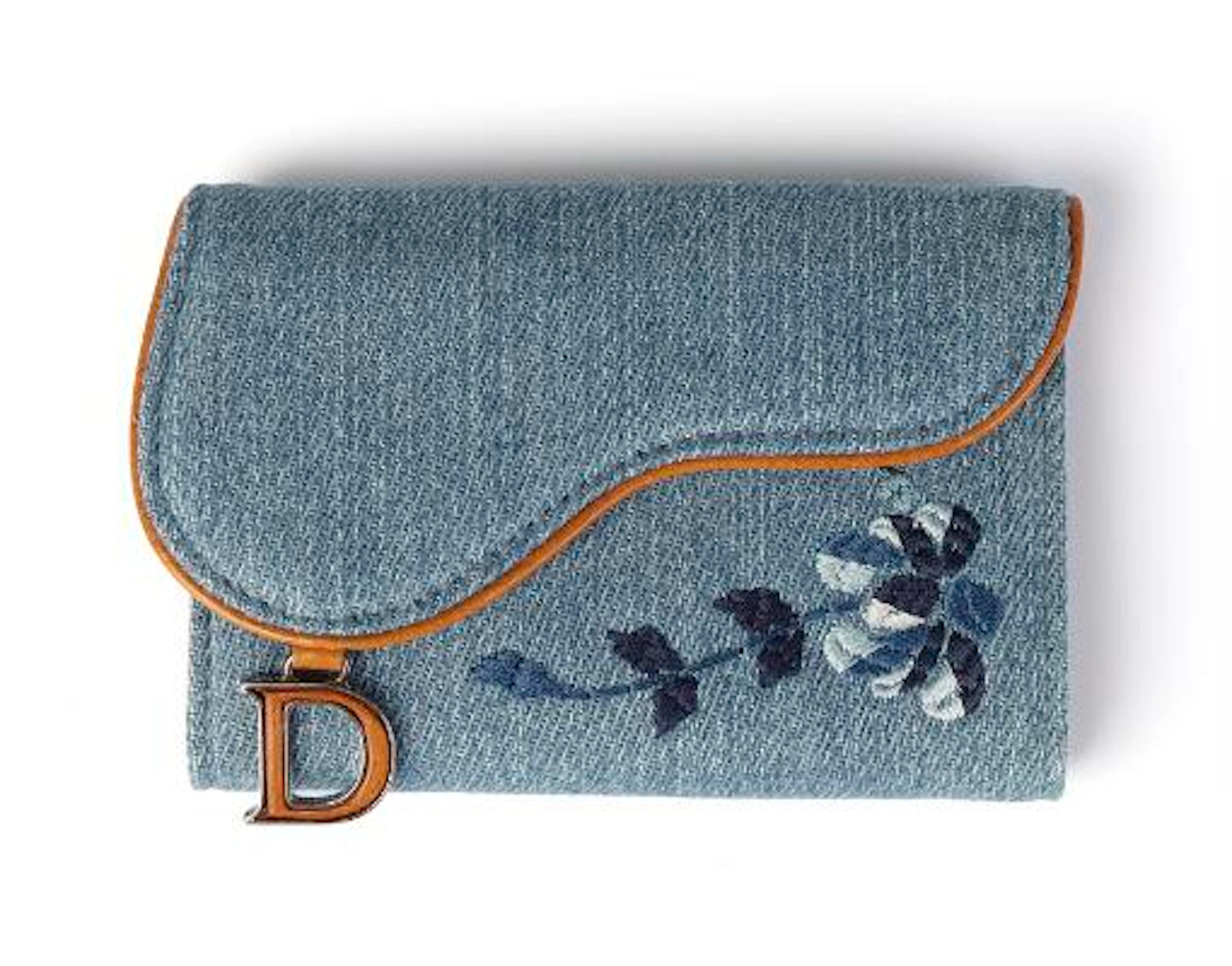 Christian Dior: A "Saddle Key Holder" of blue denim and brown leather