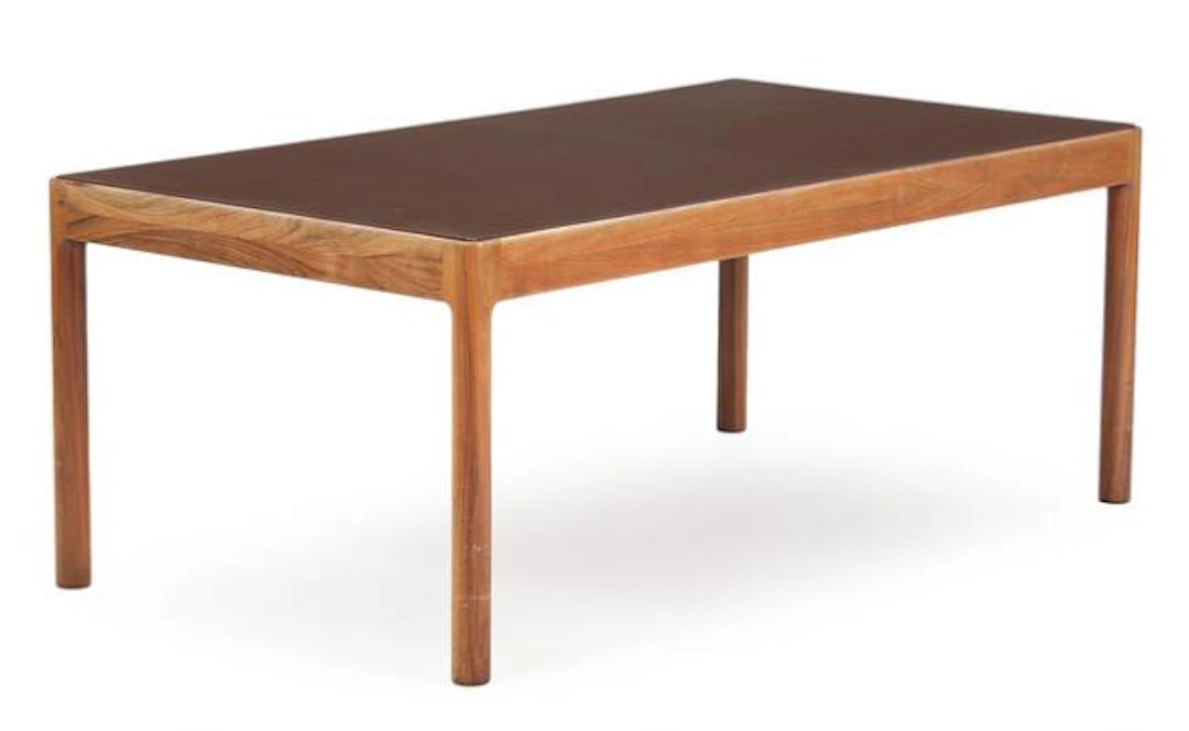 Danish furniture design: A rosewood coffee table, top with brown leather.
