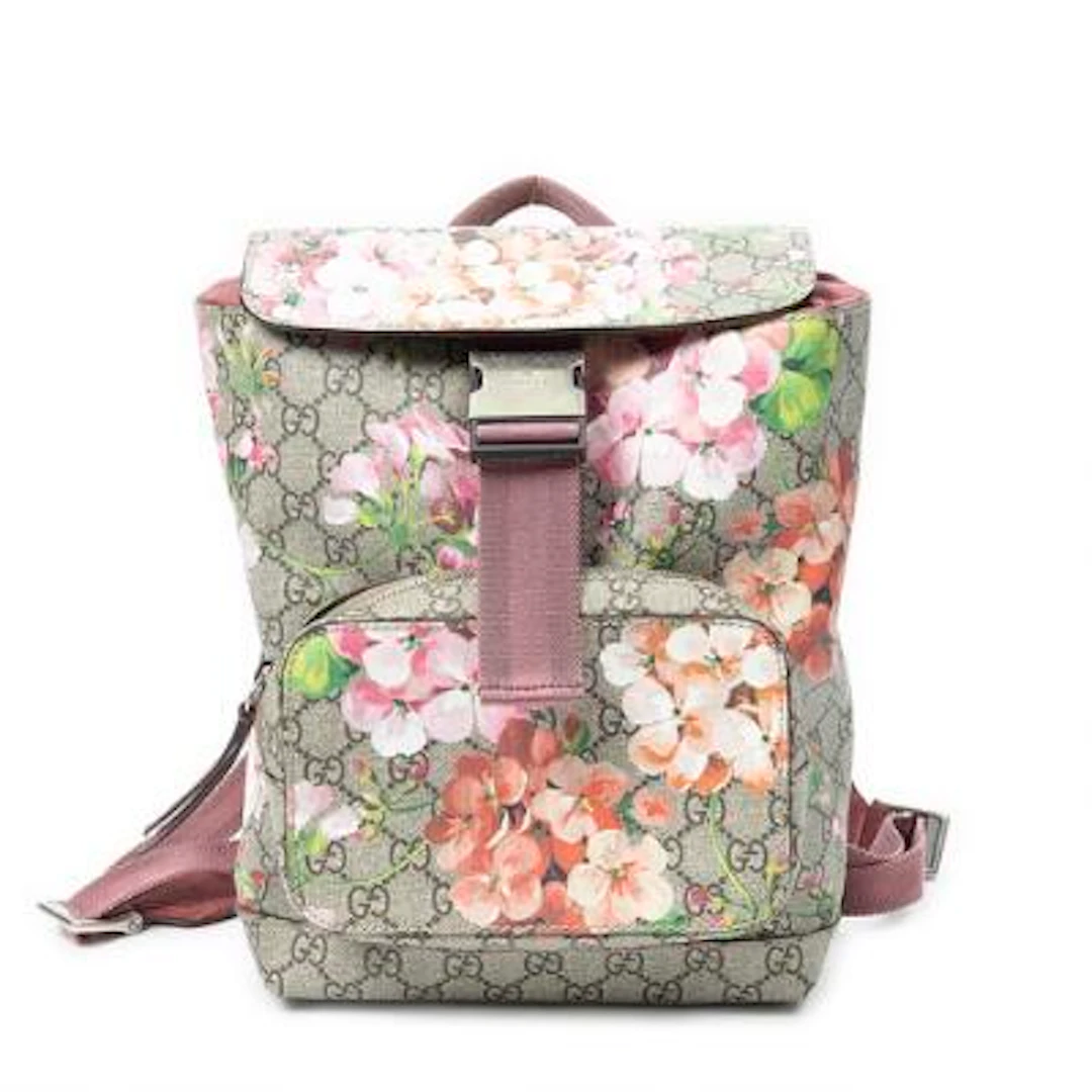 Gucci: A "Blooms Backpack" of brown monogram coated canvas with rose