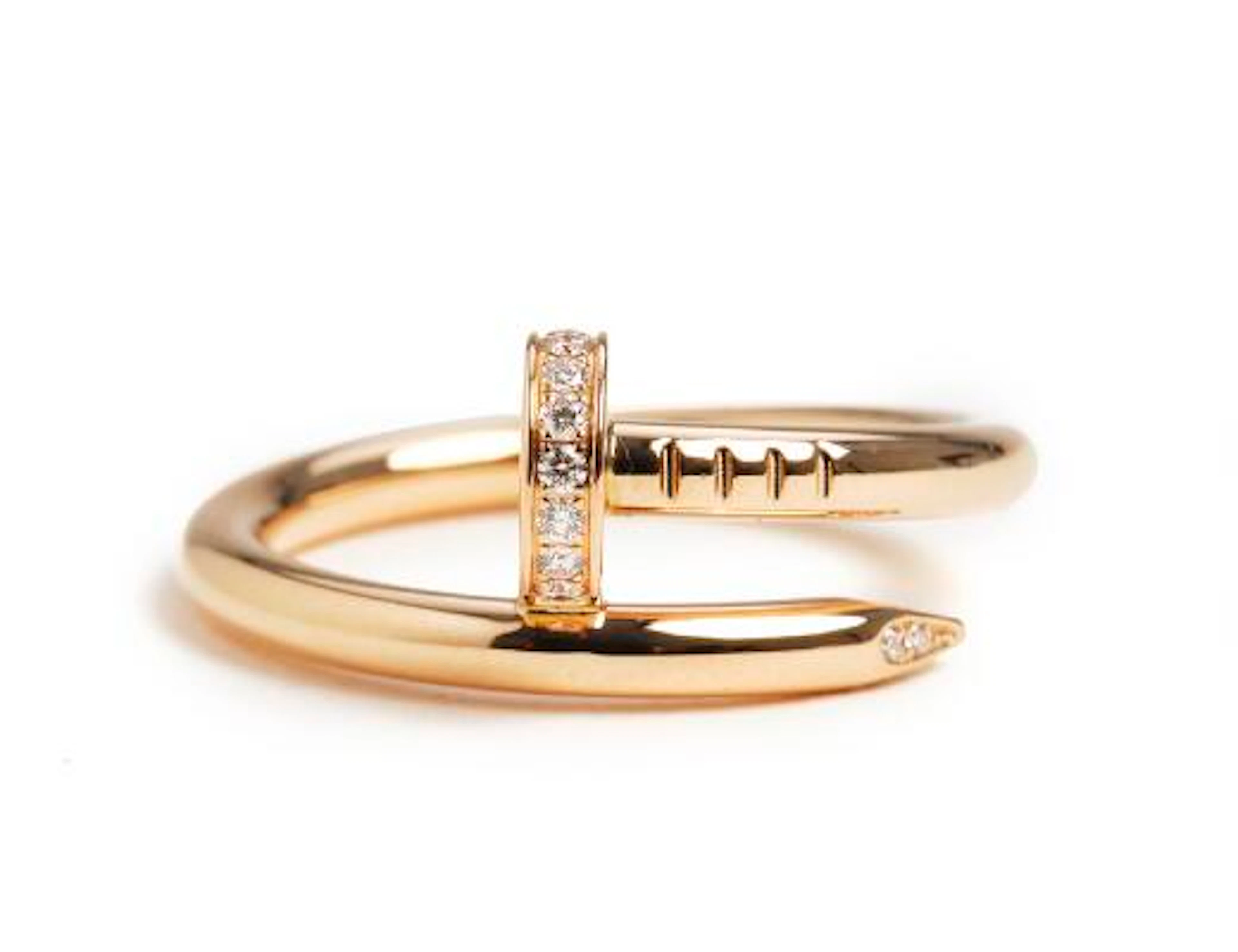 Cartier: A "Juste un Clou" diamond ring set with numerous brilliant-cut