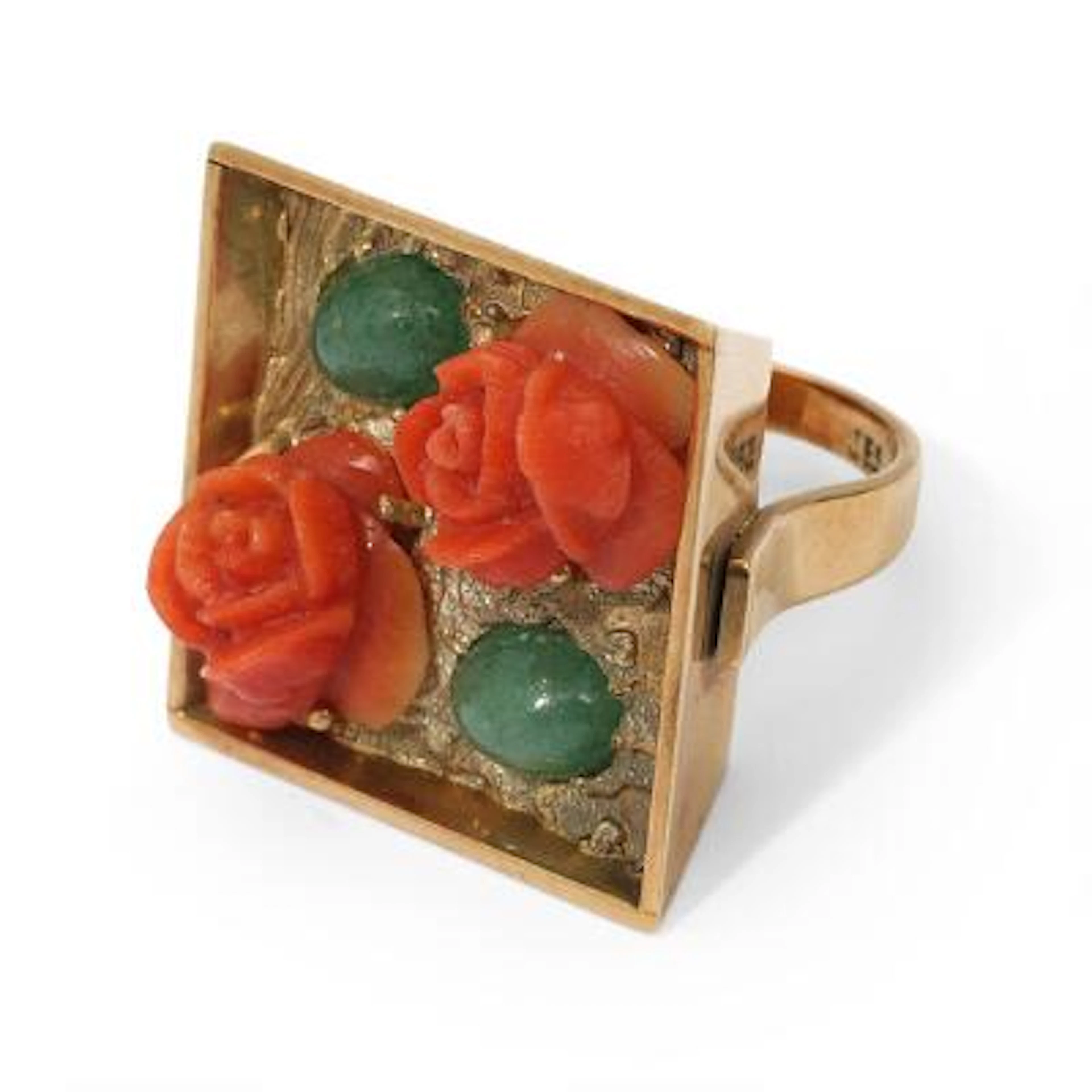 A ring set with carved coral and aventurines, mounted in 14k gold.