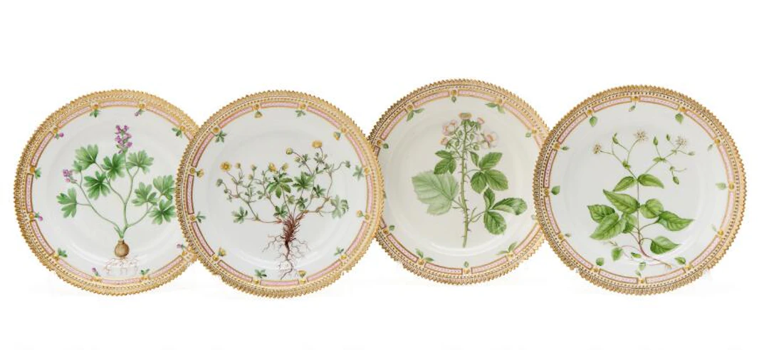 Four "Flora Danica" enamelled and gilt porcelain lunch plates. Royal
