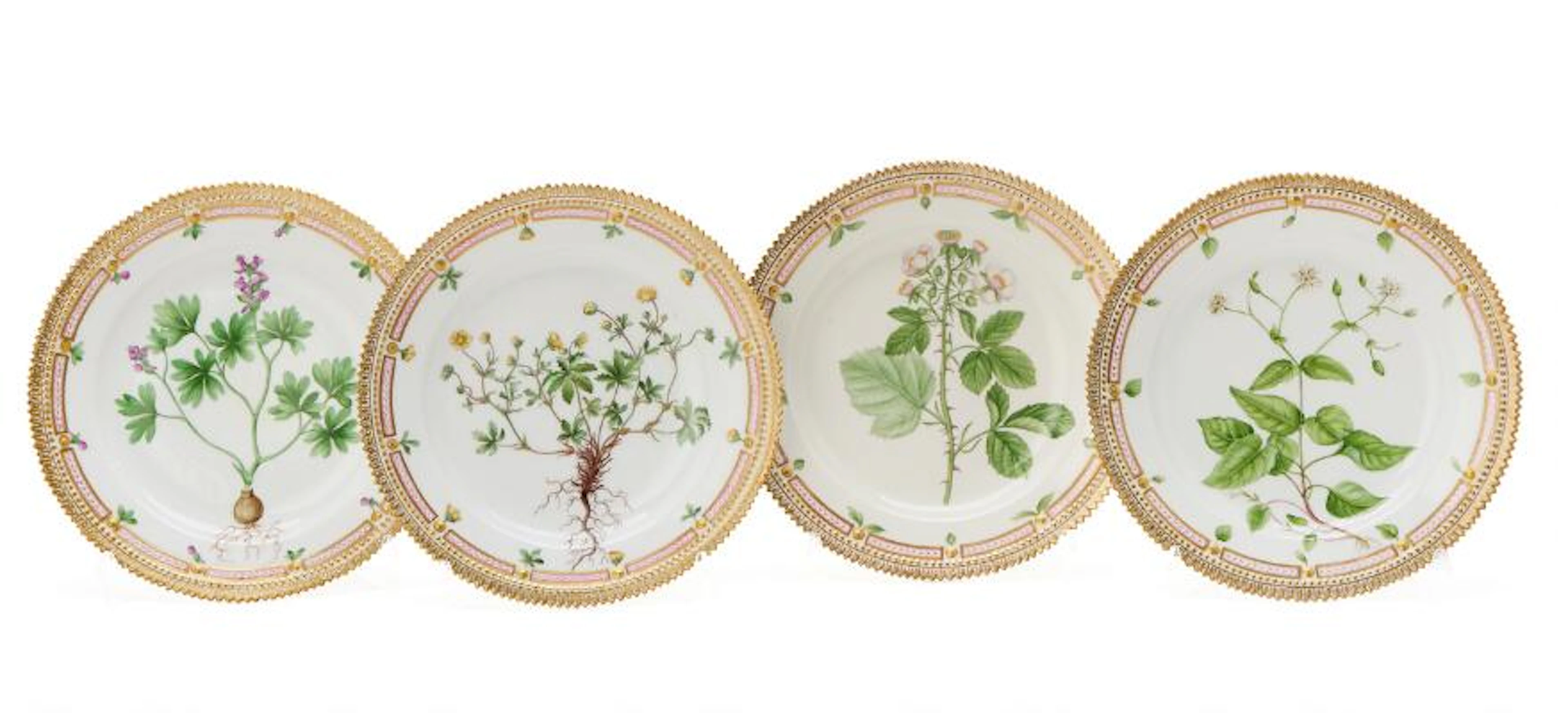 Four "Flora Danica" enamelled and gilt porcelain lunch plates. Royal