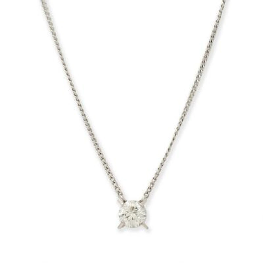 A necklace with a solitaire diamond pendant, mounted in platinum.