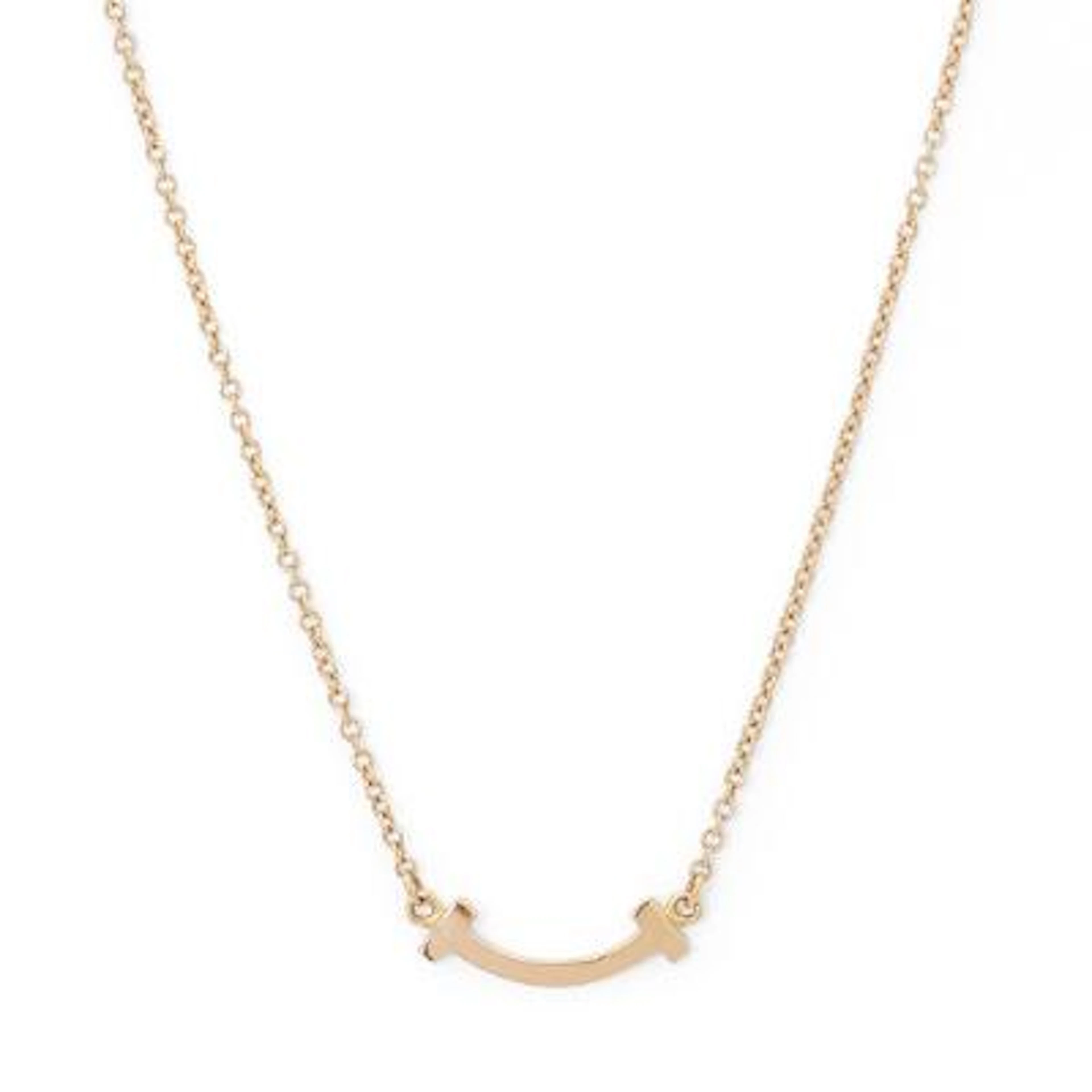 Tiffany & Co.: A "T Smile" necklace of 18k rose gold. Weight app.