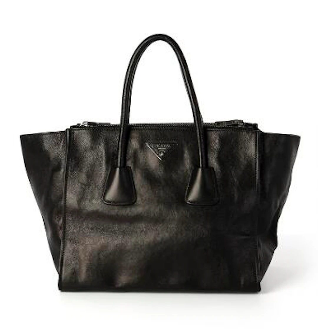 Prada: A "Twin Pocket" bag of black leather with silver tone hardware