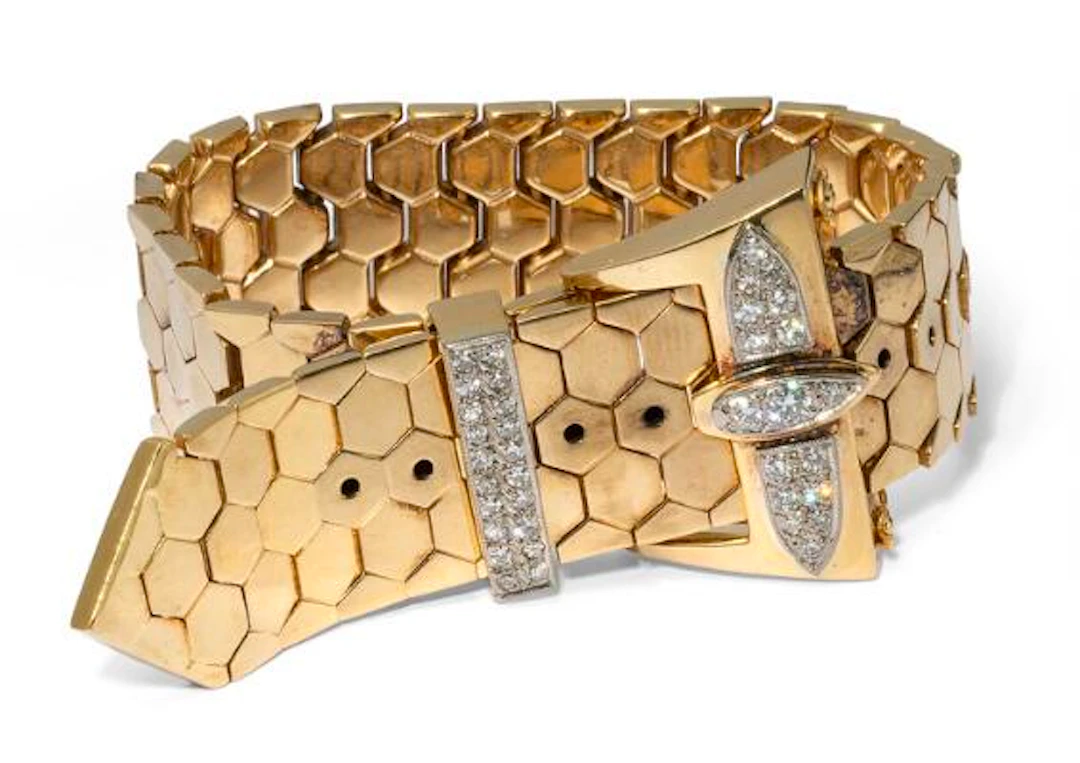 A diamond bracelet in the shape of a belt buckle, mounted in 18k gold.
