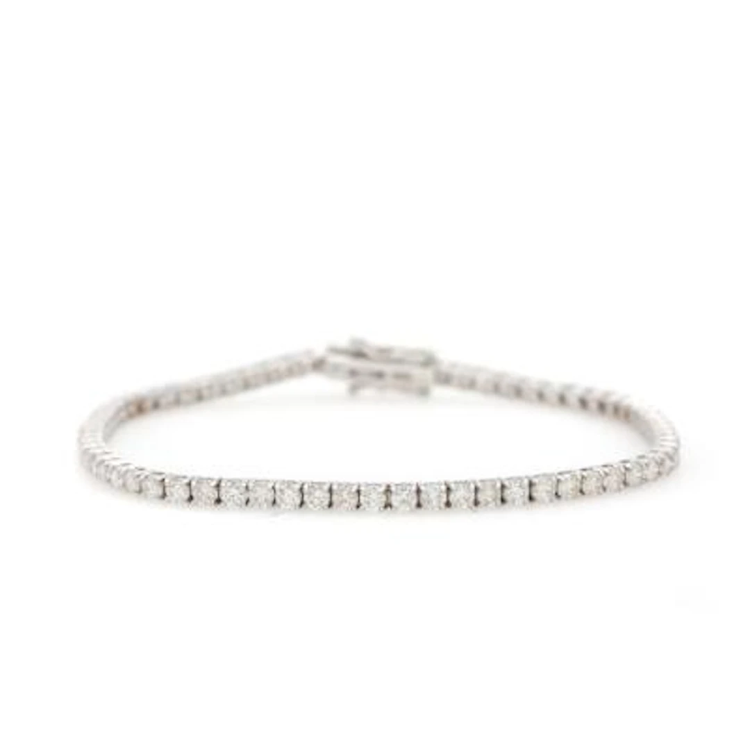 A diamond bracelet set with numerous diamonds weighing a total of