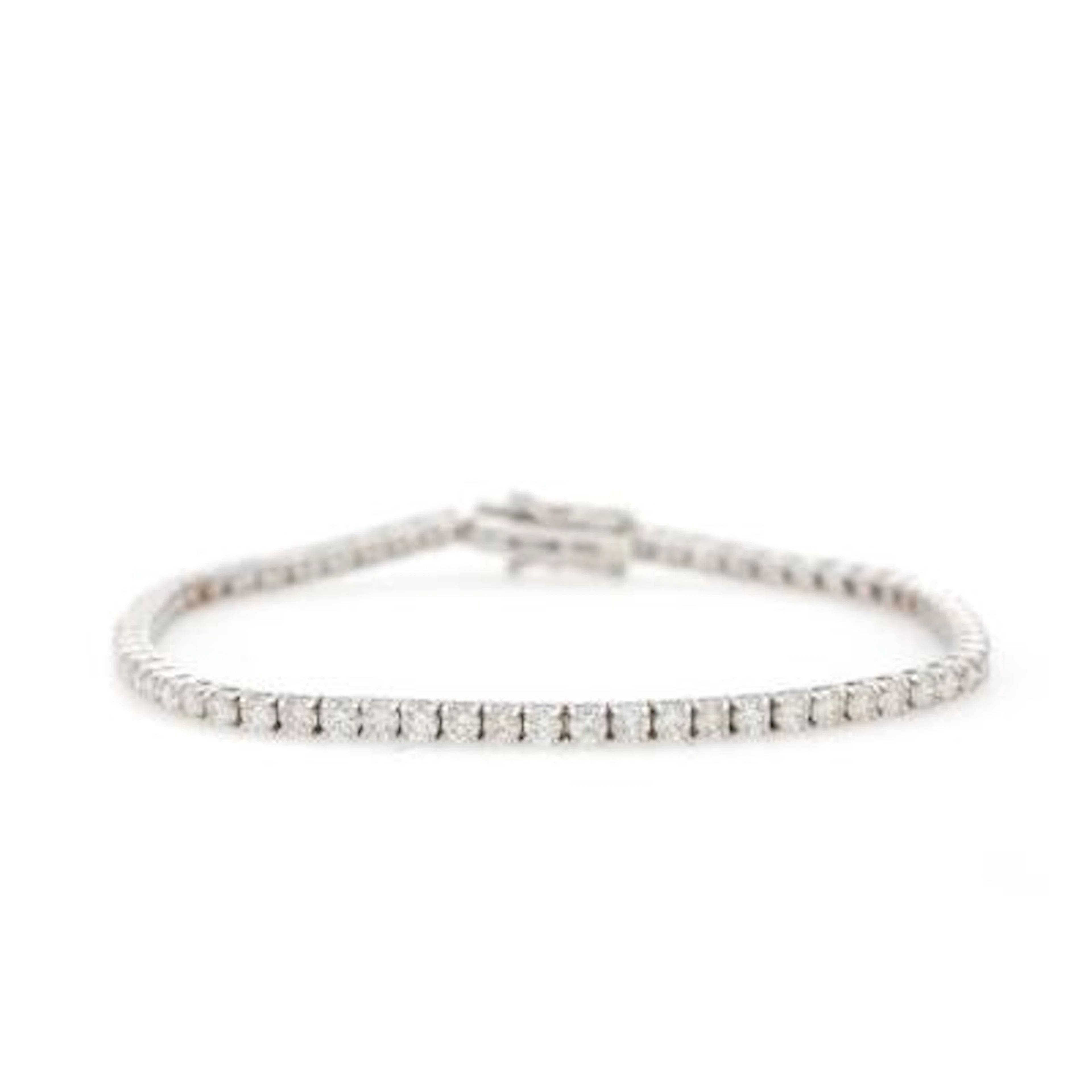 A diamond bracelet set with numerous diamonds weighing a total of