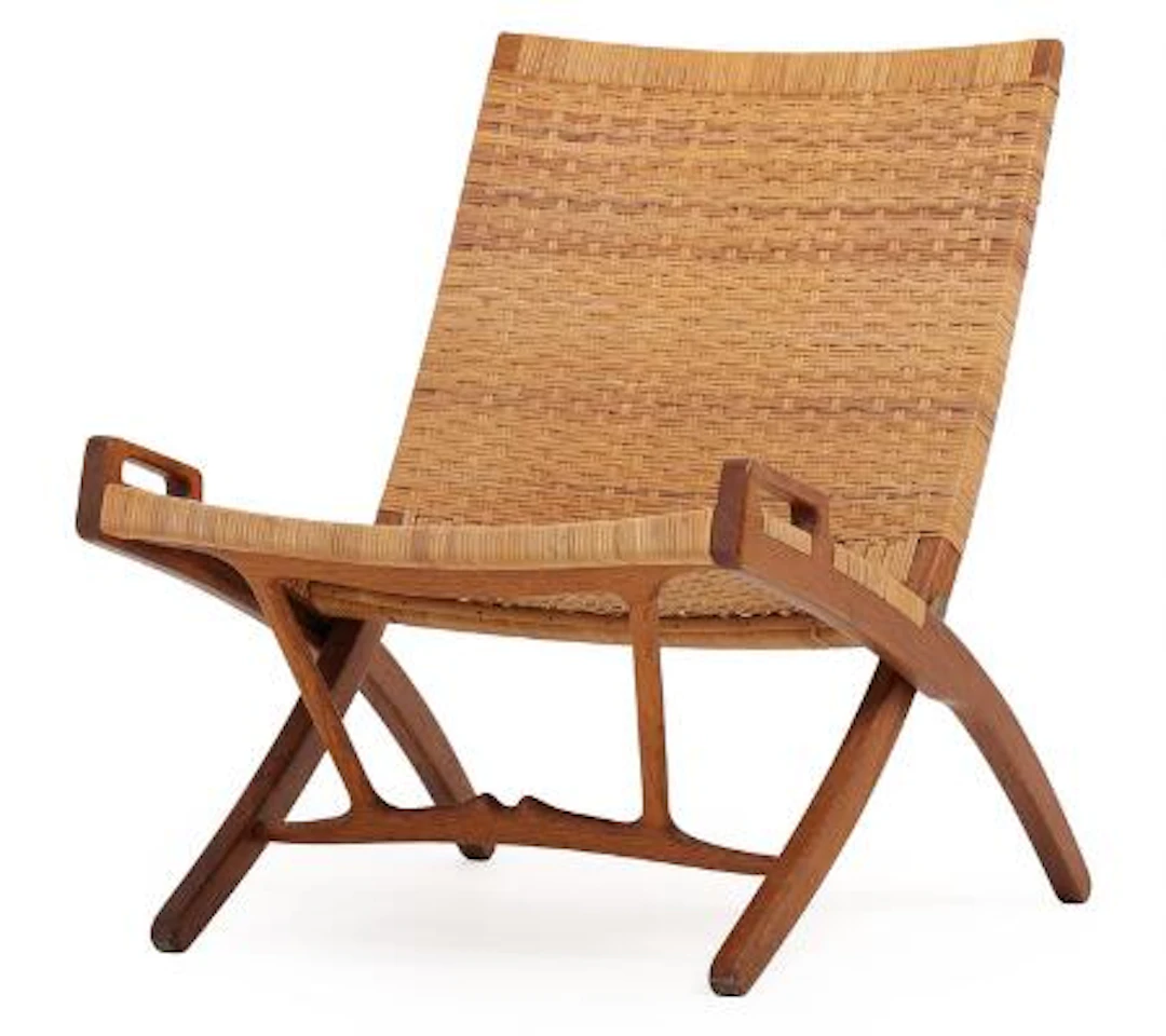Hans J. Wegner: “JH 512”. A patinated oak folding chair, seat and