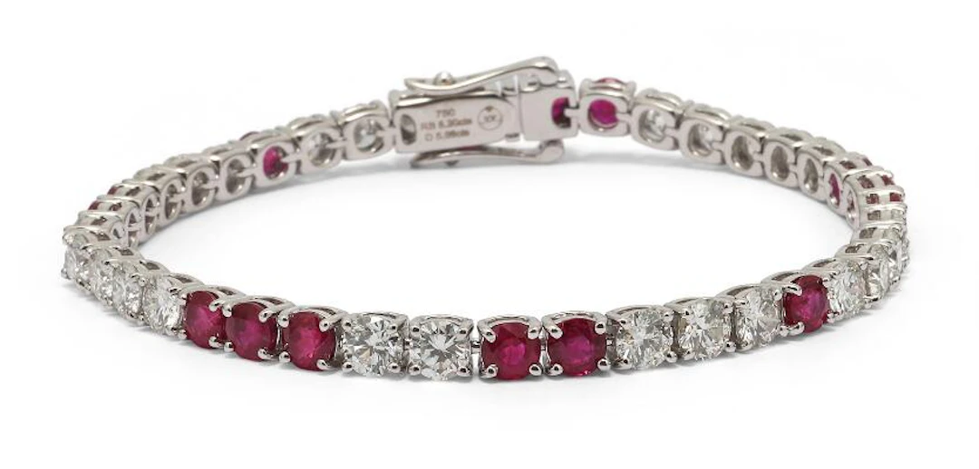 A ruby and diamond bracelet set with numerous rubies and diamonds