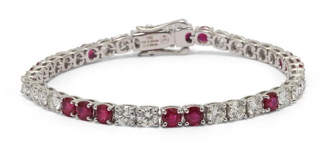 A ruby and diamond bracelet set with numerous rubies and diamonds