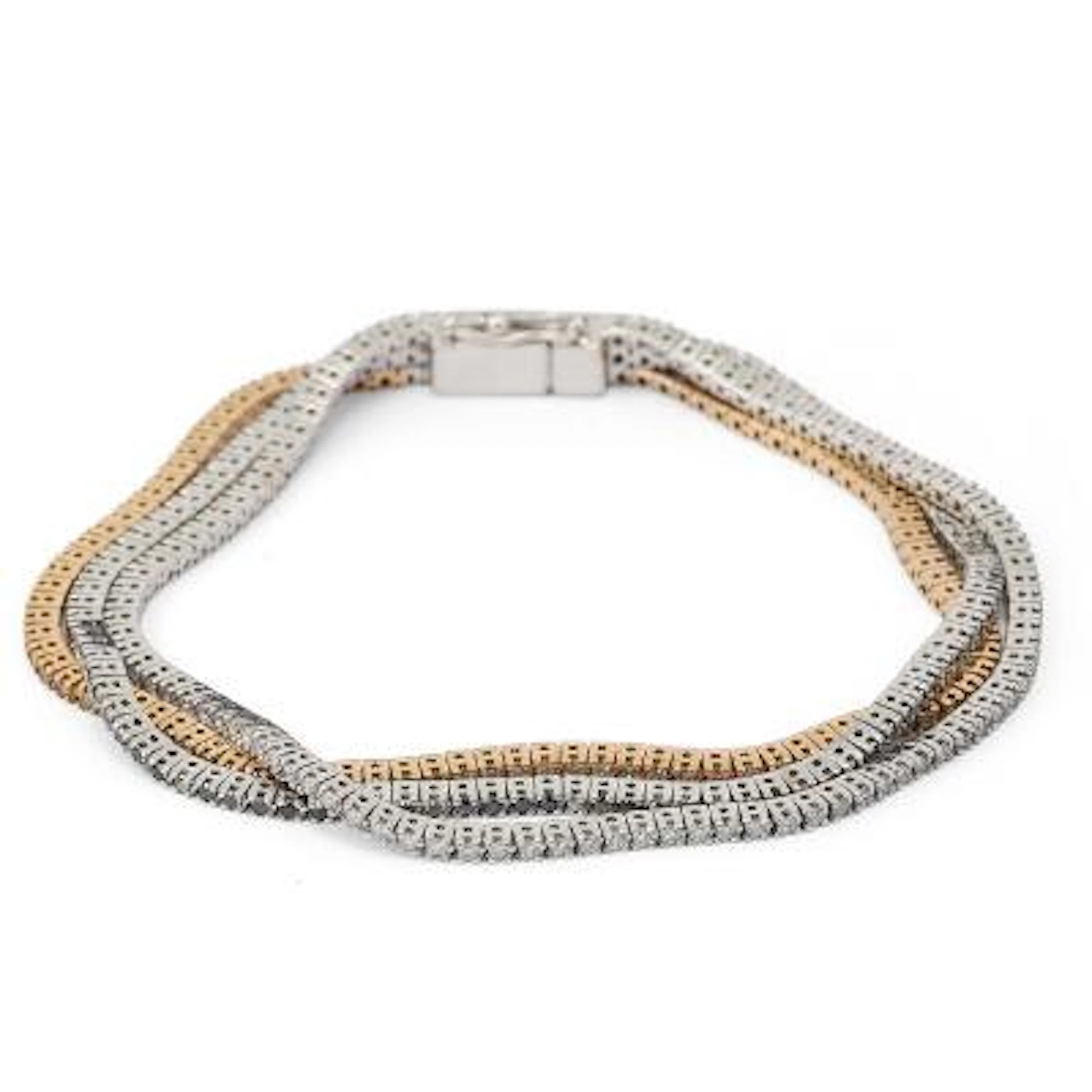 A three-strand diamond bracelet set with numerous diamonds, black