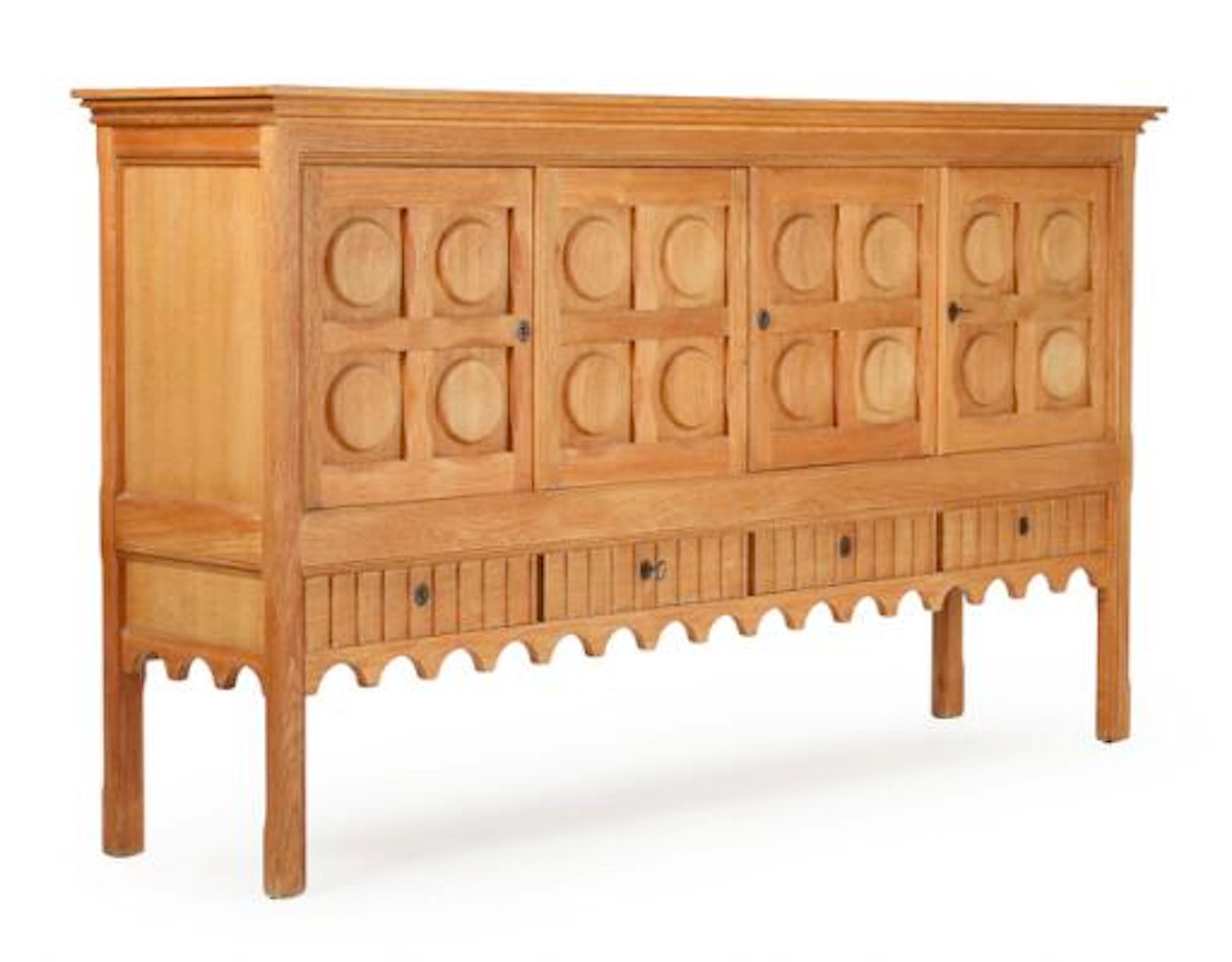 Henry Kjærnulf: A patinated oak sideboard with carvings, front with