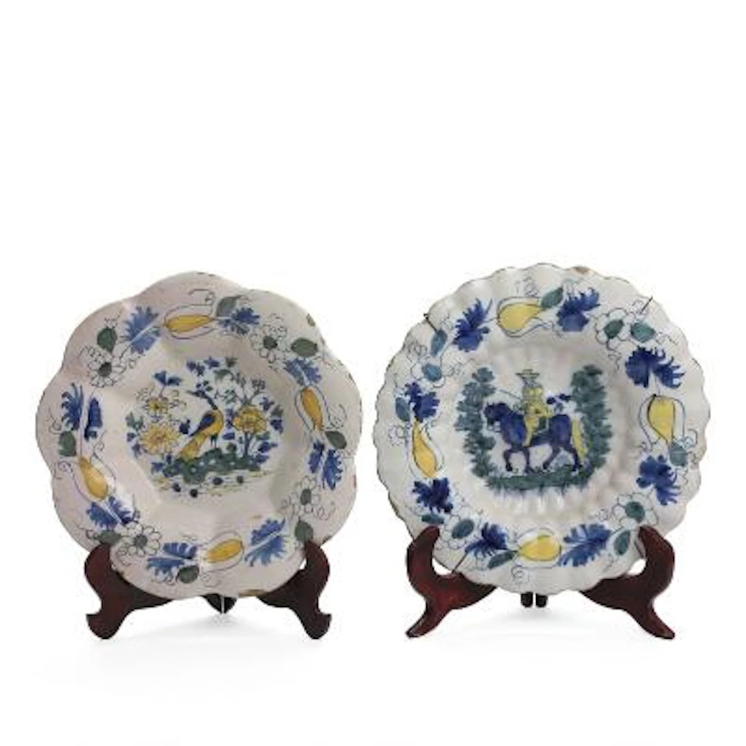 Two faience gadrooned dishes decorated with horseman and hare respectively.