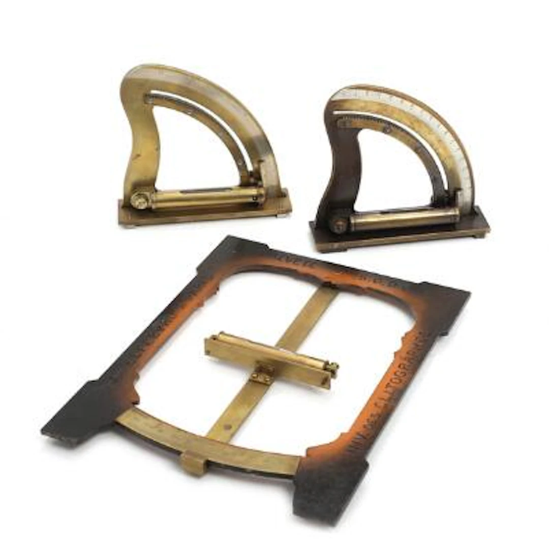French clitograph of brass and iron. And two brass direction quadrants.