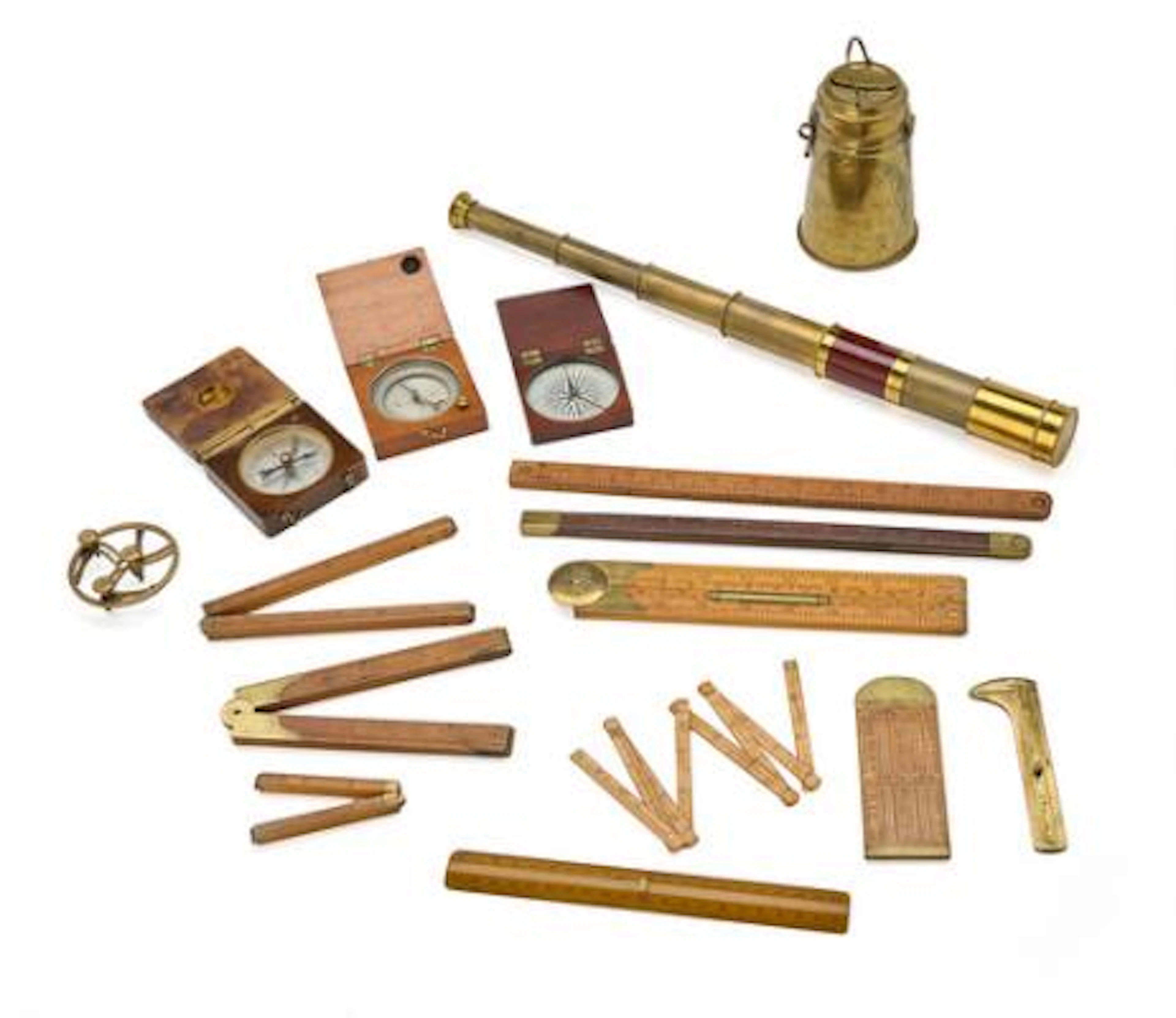 Collection of folding rulers, compasses, telescope, empire money box