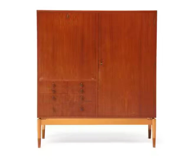 Finn Juhl: A teak cabinet with maple frame. Front with seven drawers