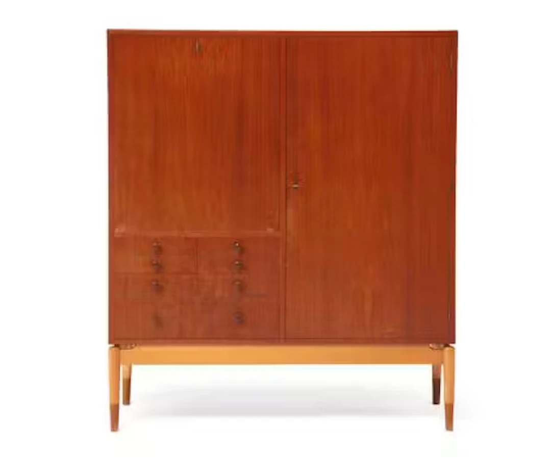 Finn Juhl: A teak cabinet with maple frame. Front with seven drawers