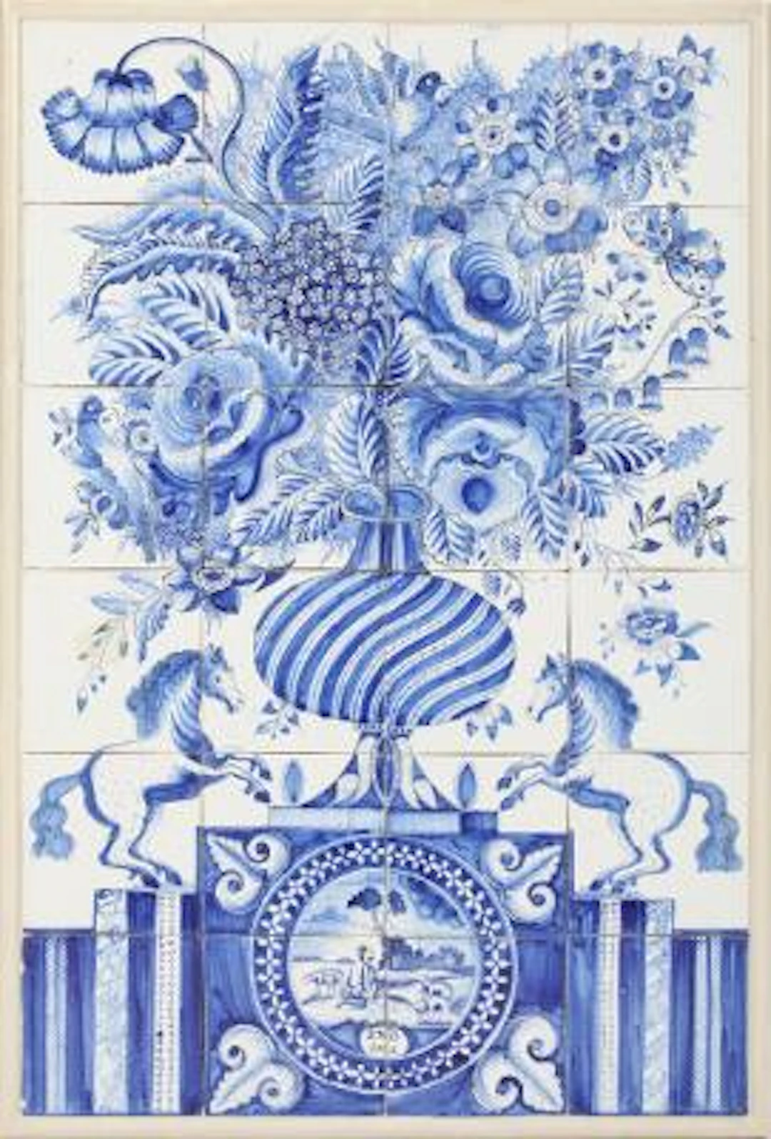 Delft tile picture of faience, decorated in blue with floral arrangement.