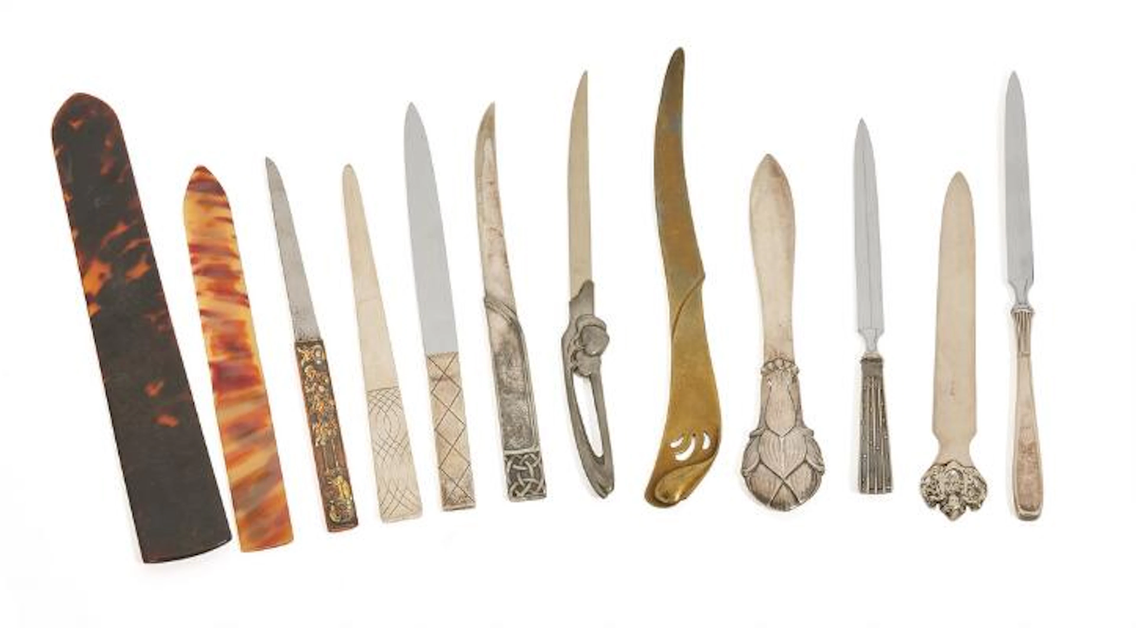 Collection of letter openers, partly in silver, partly in bronze