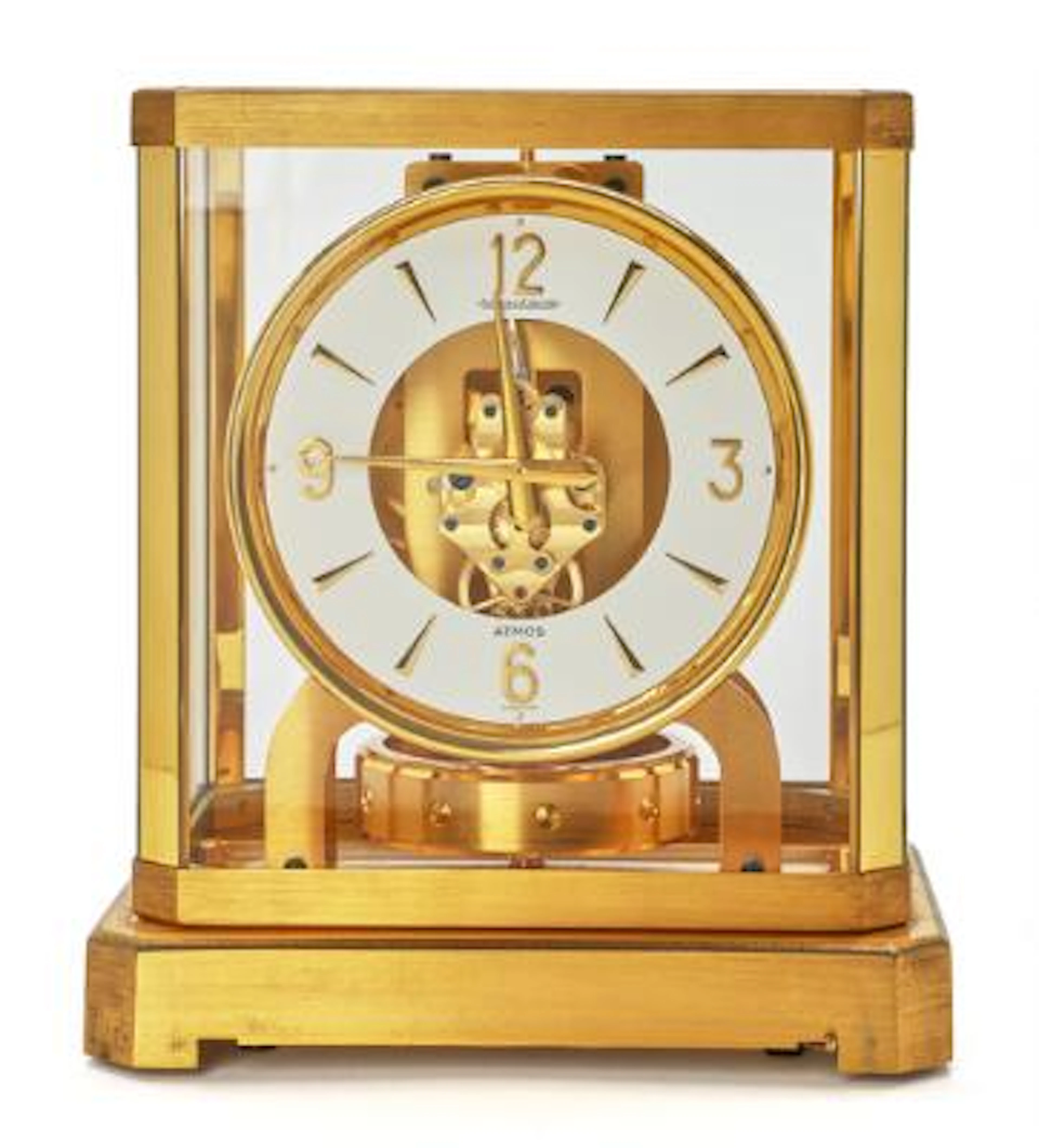 Jaeger-LeCoultre: Atmos table clock of gilded brass and cut glass.