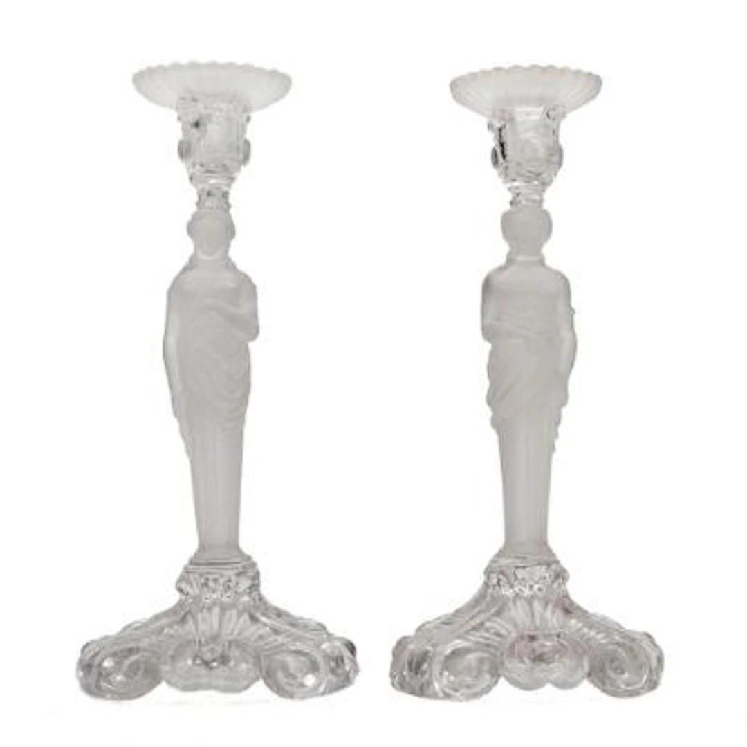 A pair of French candlesticks of glass, stems in the form of caryatids.