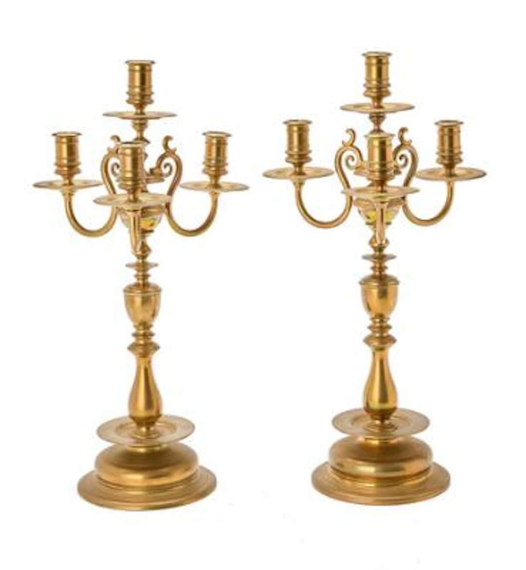 A pair of Baroque style candelabra in brass, Sweden early 20th century.