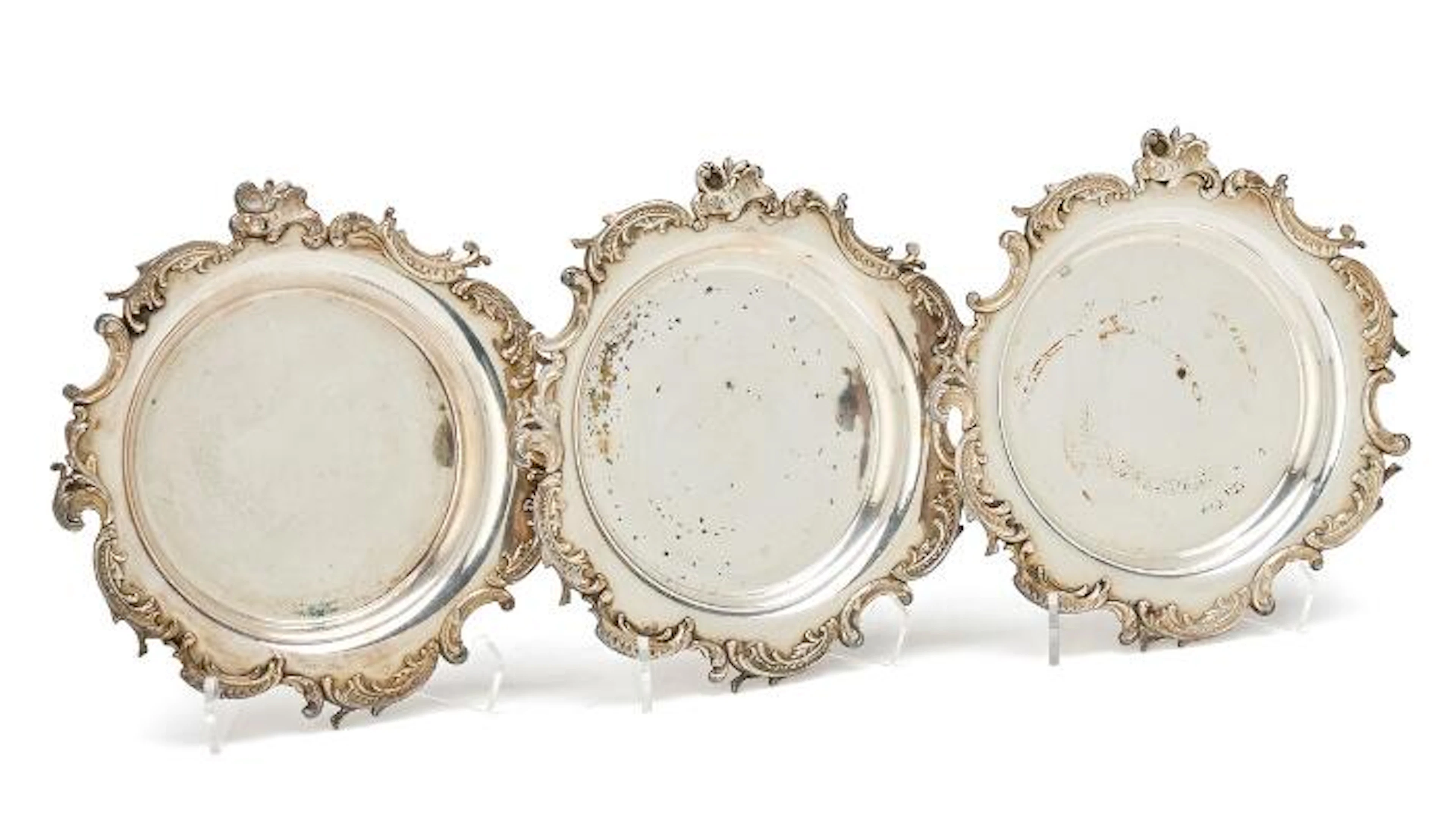 Three French silverplated wine coasters, Rococo style, late 19th century.