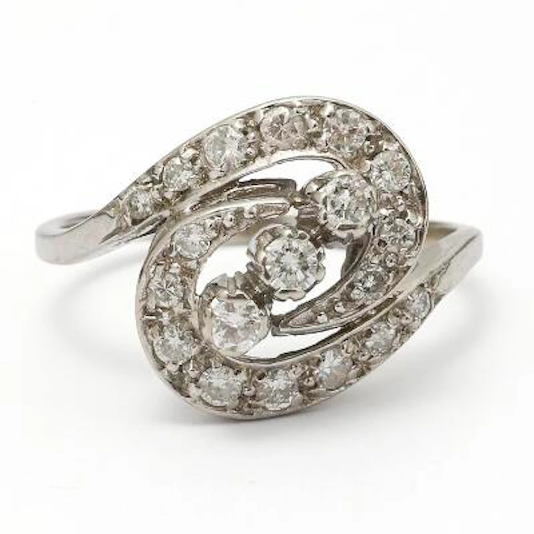 A diamond ring set with brilliant-cut diamonds, mounted in 14k white