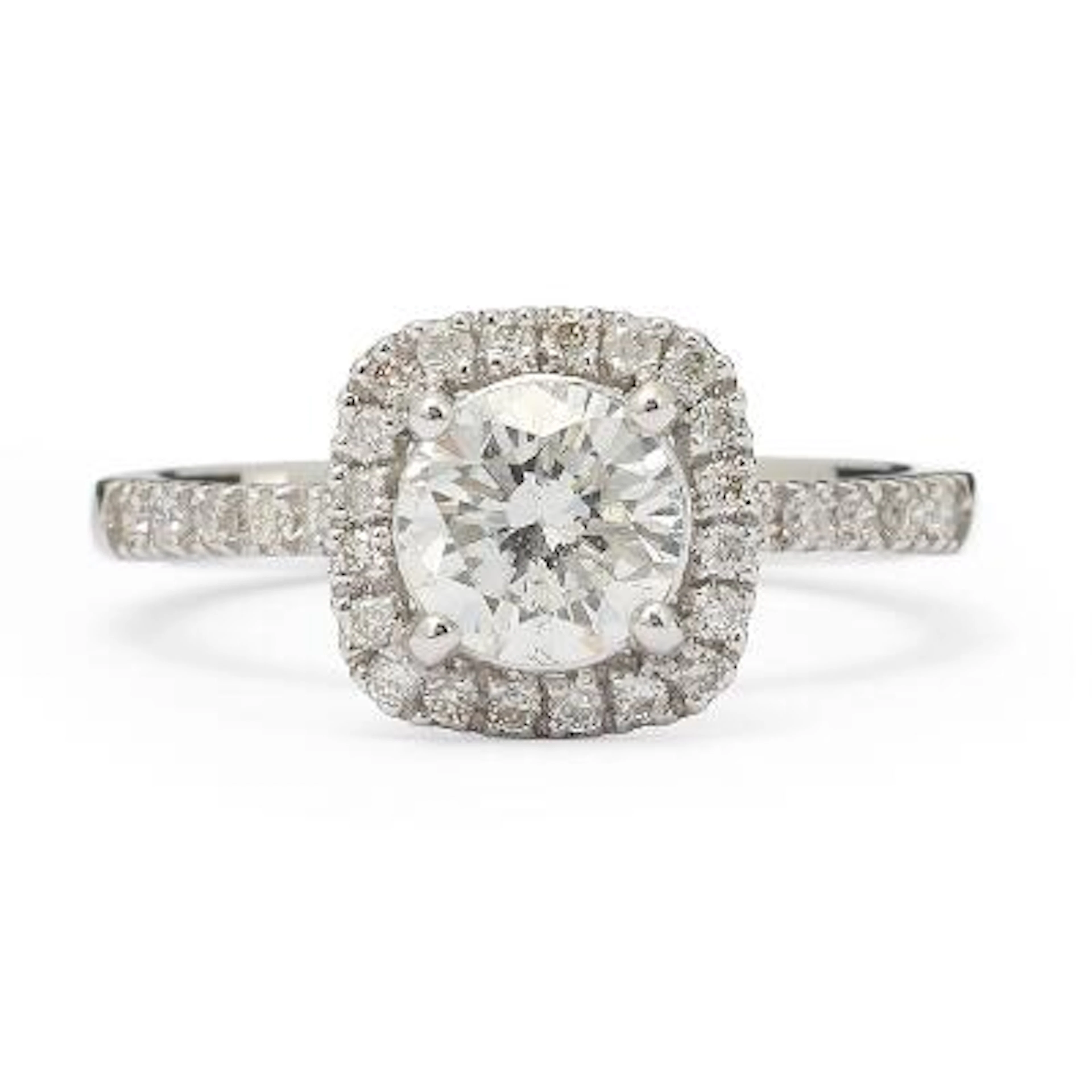 A diamond ring set with a diamond encircled by numerous diamonds
