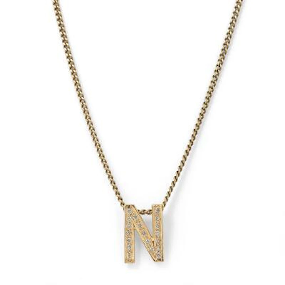 A necklace and pendant in the shape of a letter set with diamonds