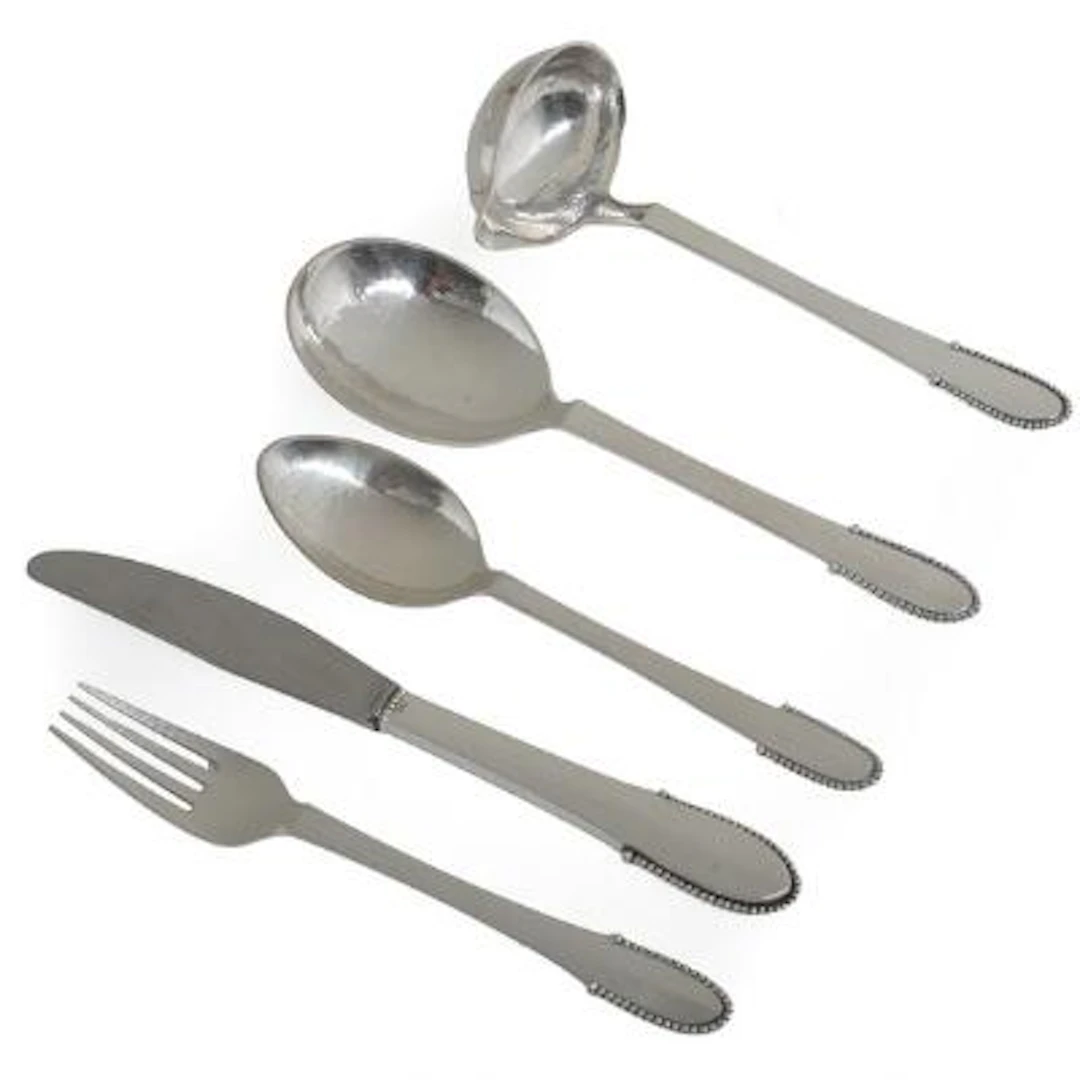 Georg Jensen: "Beaded". Sterling silver flatware. Manufactured by