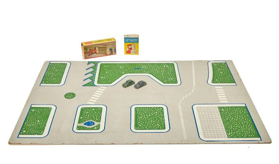 LEGO Bricks: Two boxes 1236 and 1245, two cars and masonite town plan.