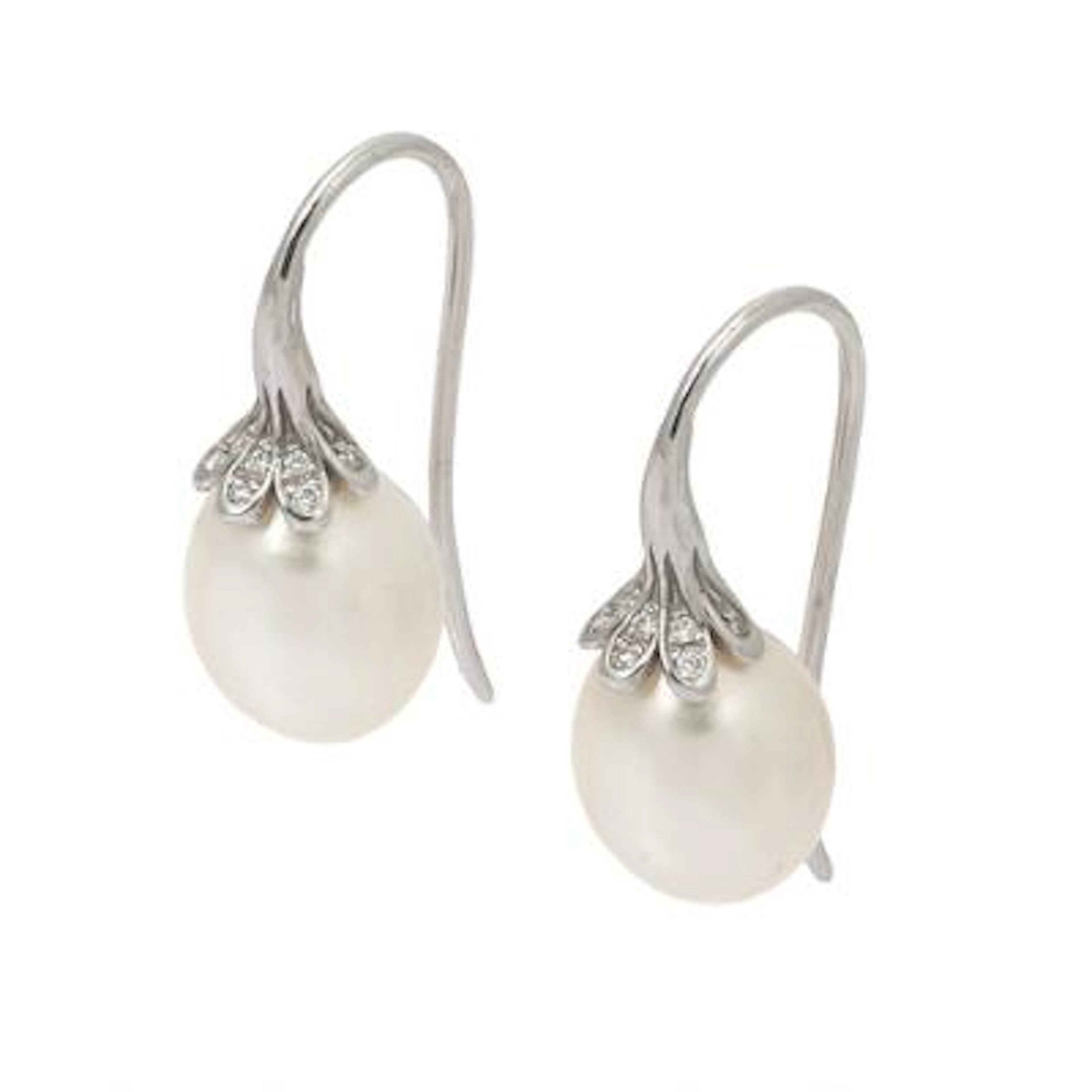A pair of pearl and diamond ear studs each set with freshwater pearls