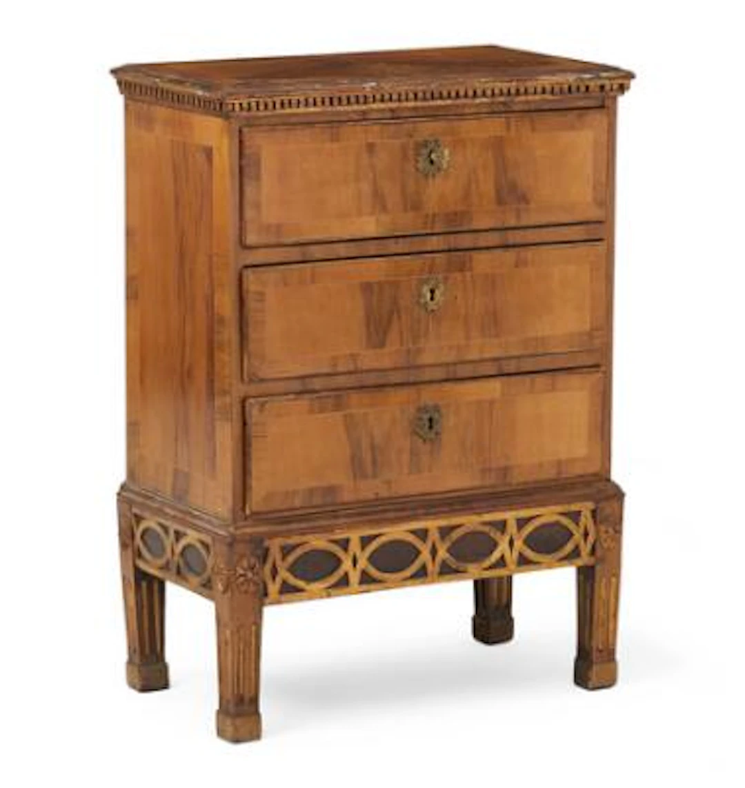 A Danish Louis XVI commode of walnut and giltwood. Late 18th century.