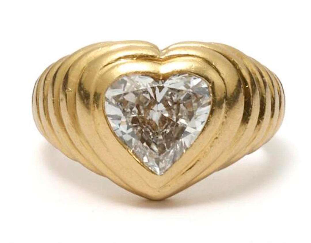 Bulgari: A diamond ring set with a heart-shaped diamond, mounted in
